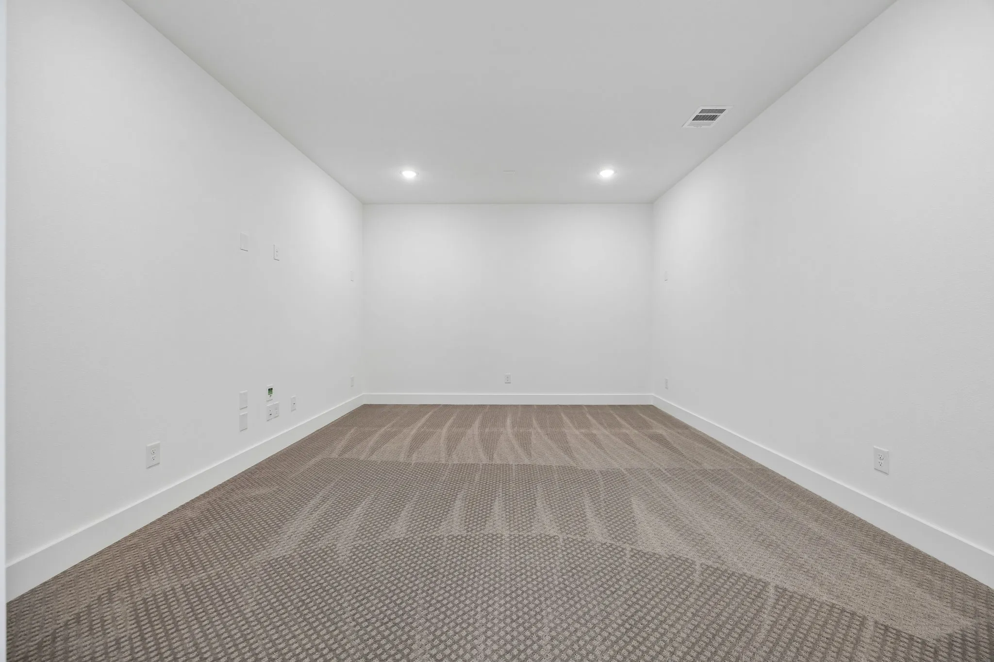 This spacious media room with adjacent game room create the ultimate family entertainment zone.