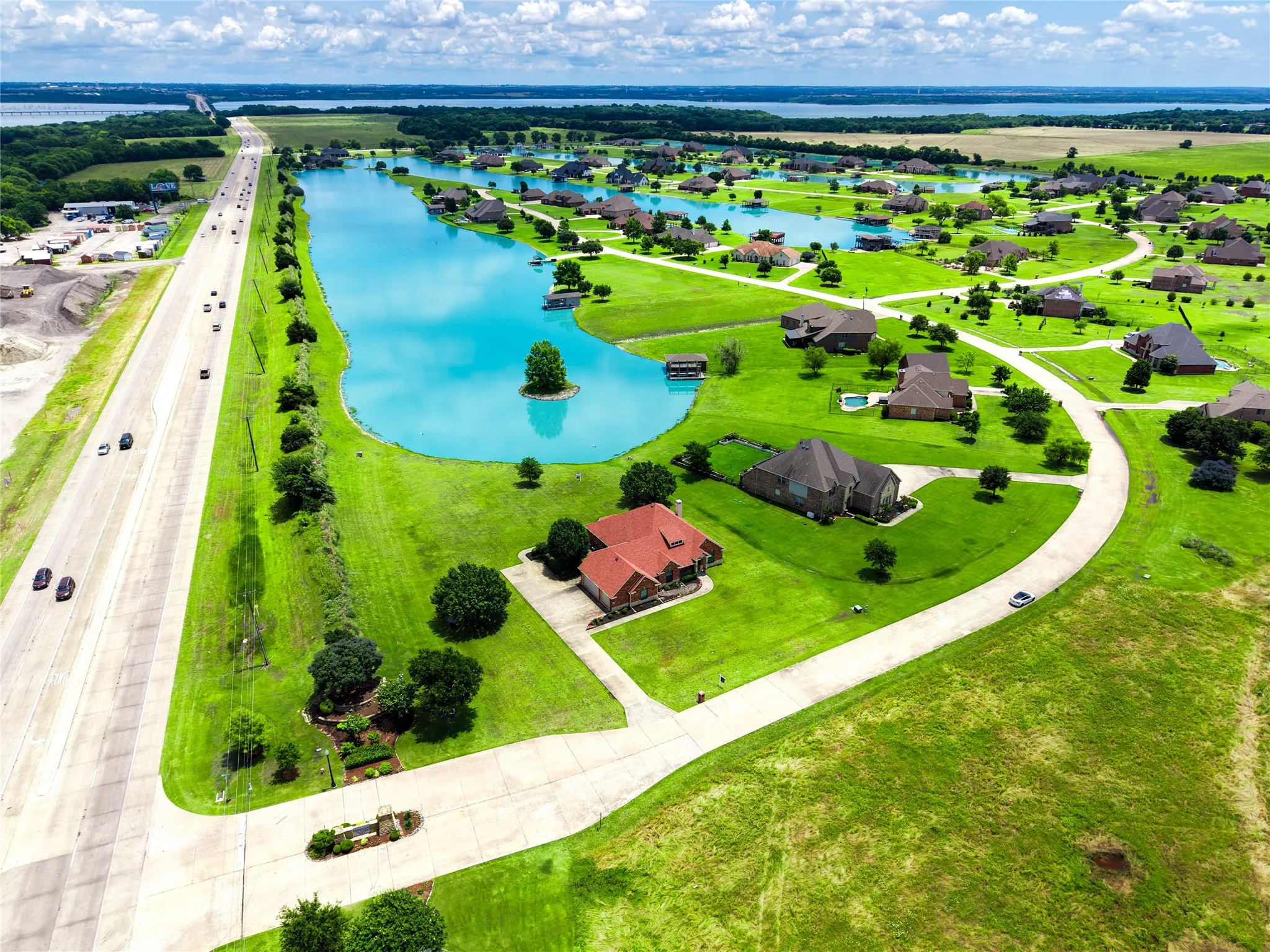 Expansive residential There 5 connction lakes, island, a multi-lane highway, and a distant body of water