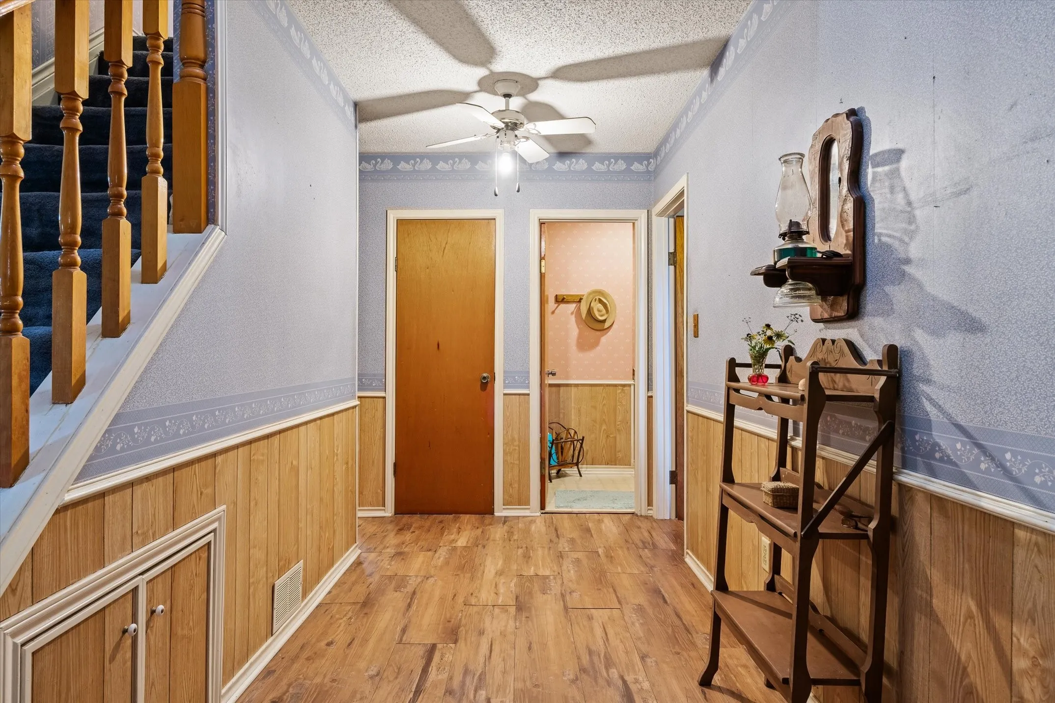 Entryway Hallway to closet, main floor half bath. Leading to Primary on the right.