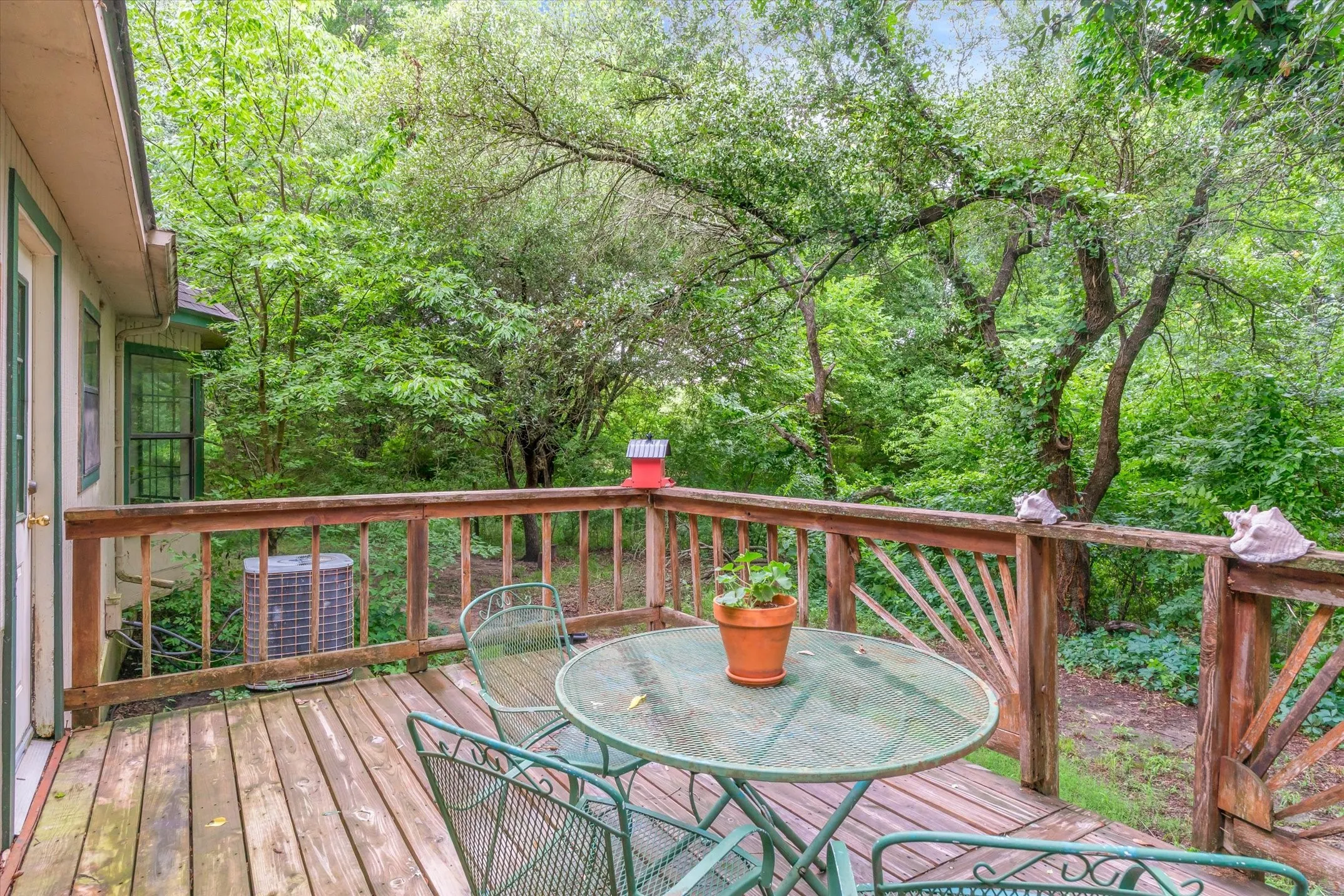 Back deck with gorgeous detailing on the railing.