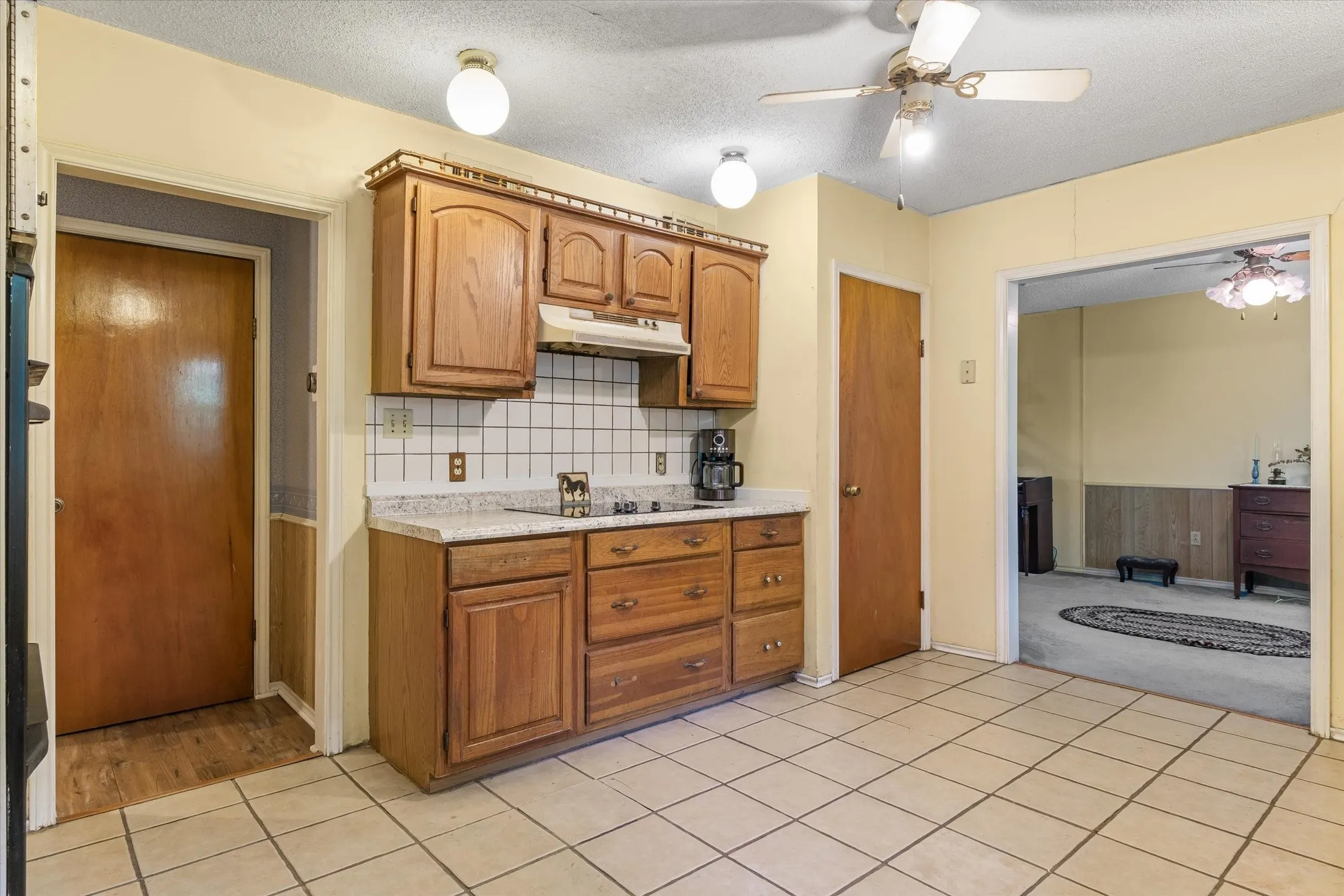 Door off kitchen leads to 15 x 10 concrete wall basement.  Furnace in basement. Room for extra storage or Weather safe space.