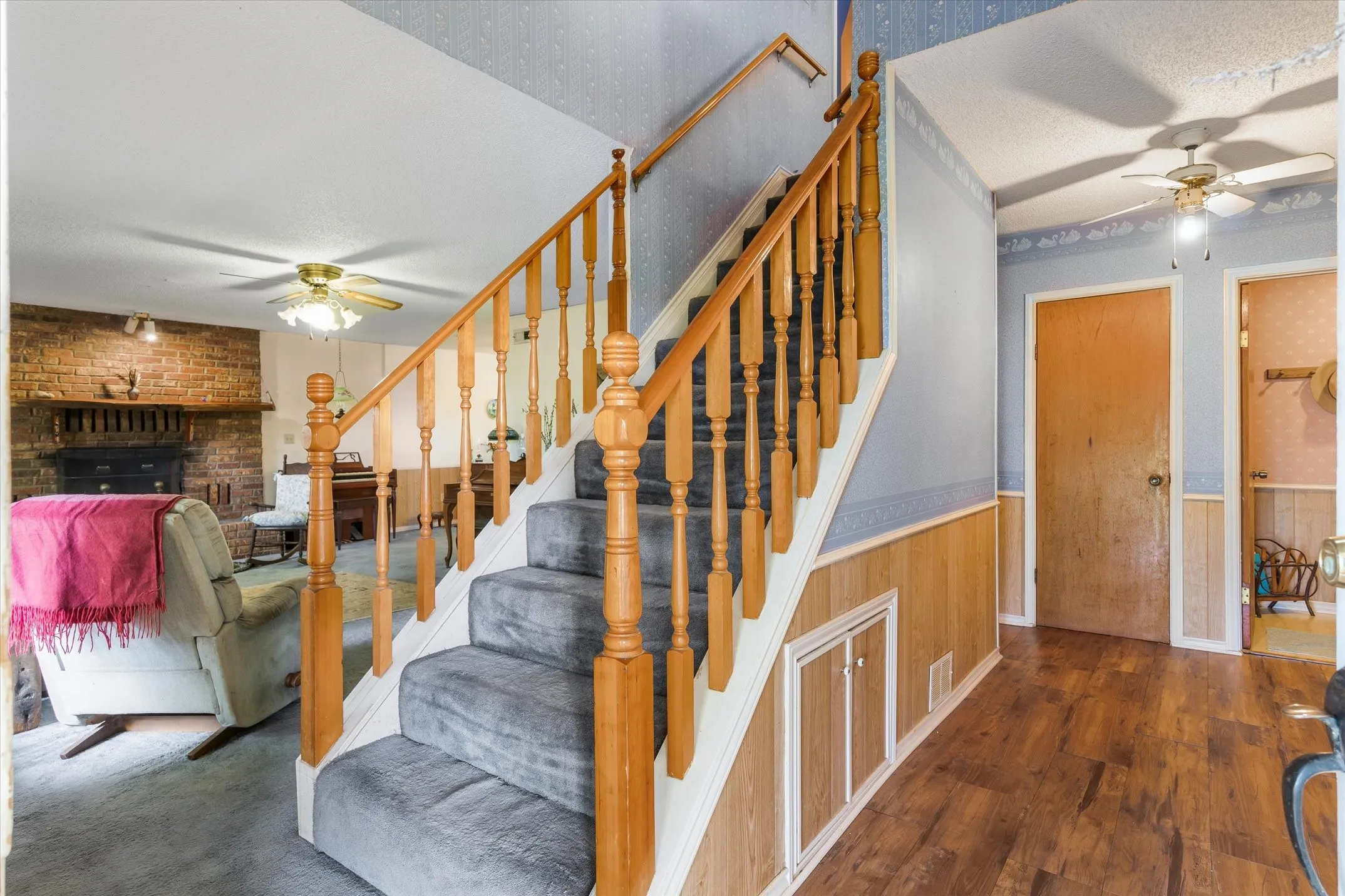 Entry with Living room to the left & Primary bedroom to the right.