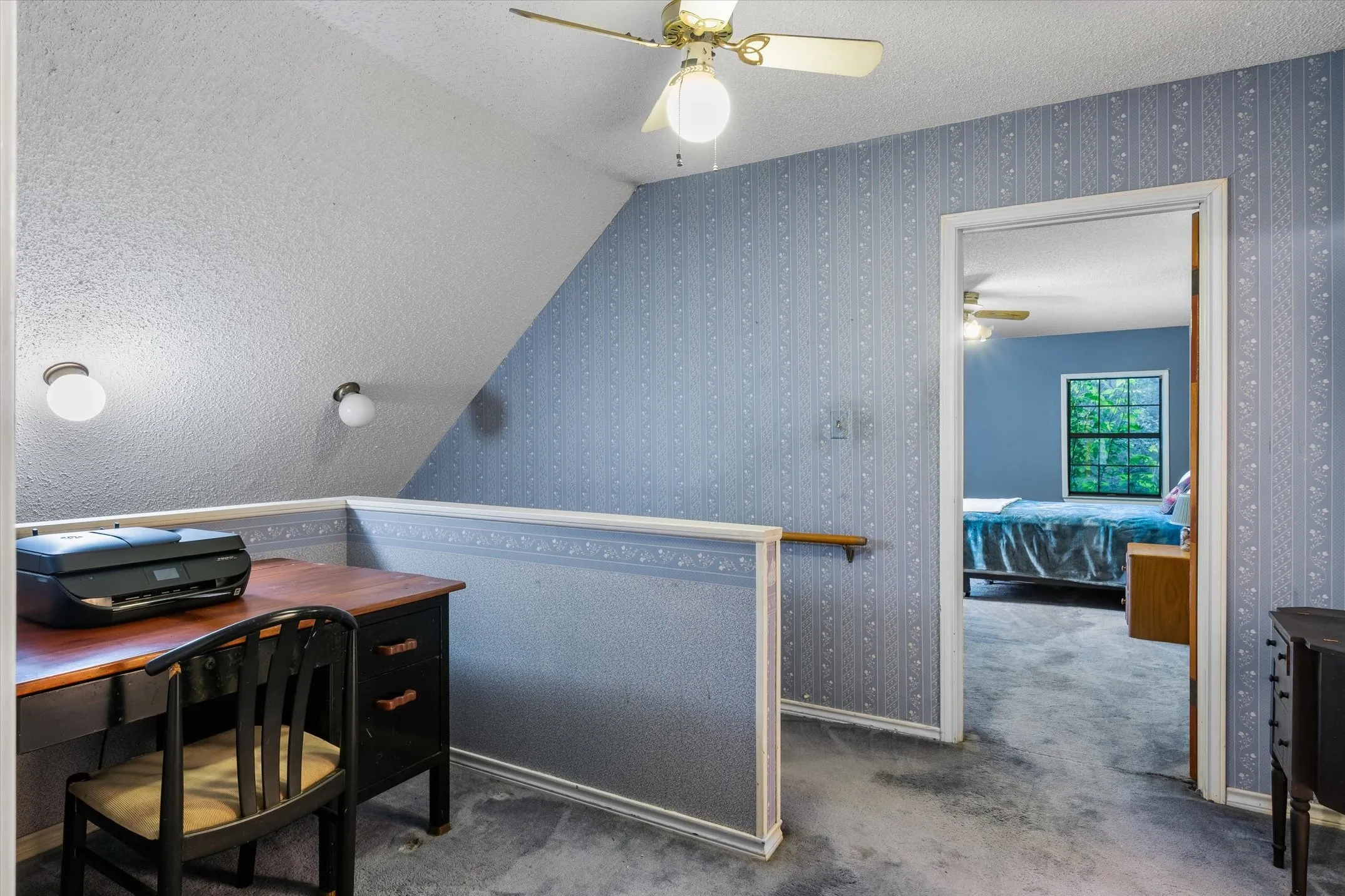 Upstairs landing can be utilized as an office space or reading nook.