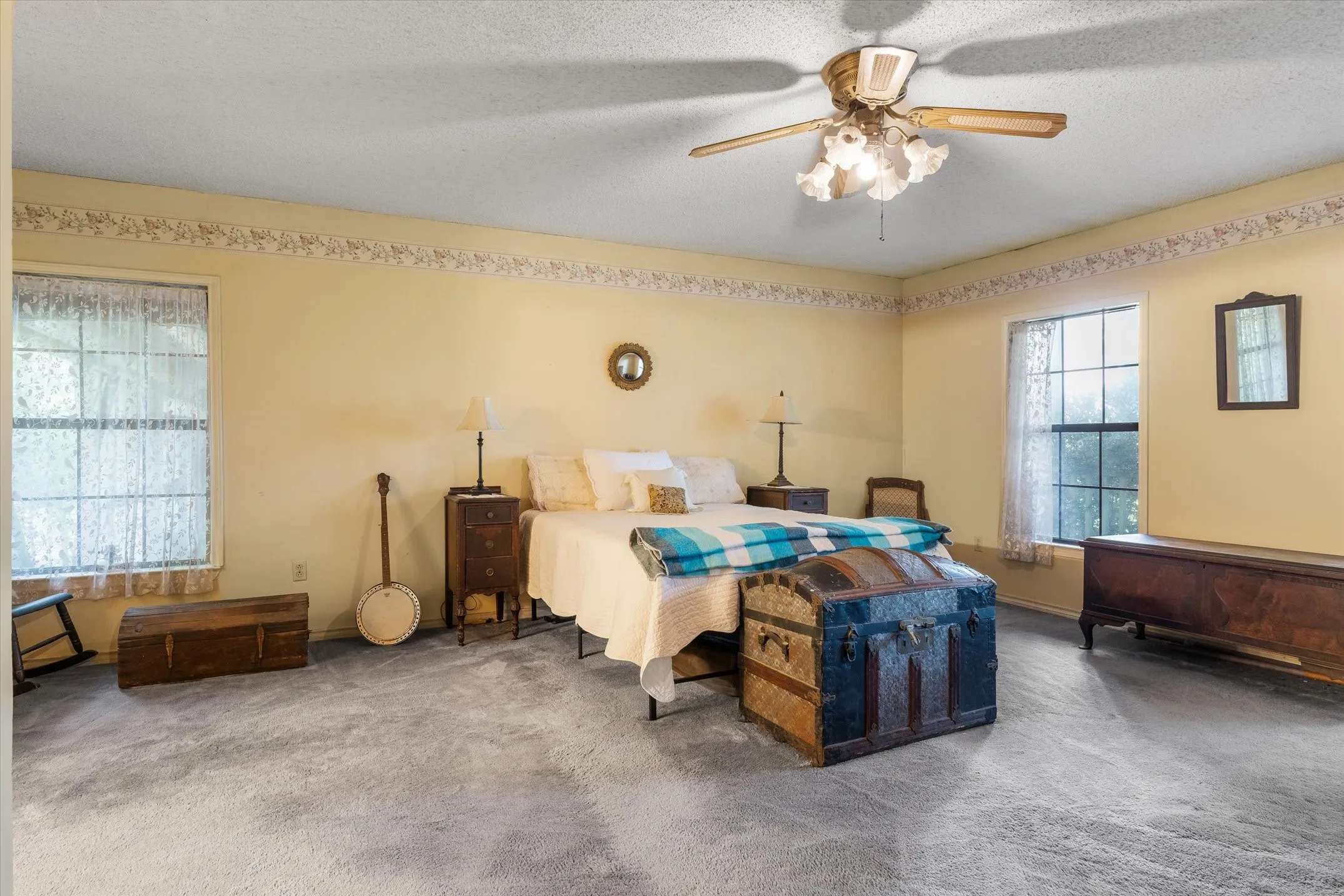 Expansive Primary bedroom with room for king size bed, large dressers and sitting area.