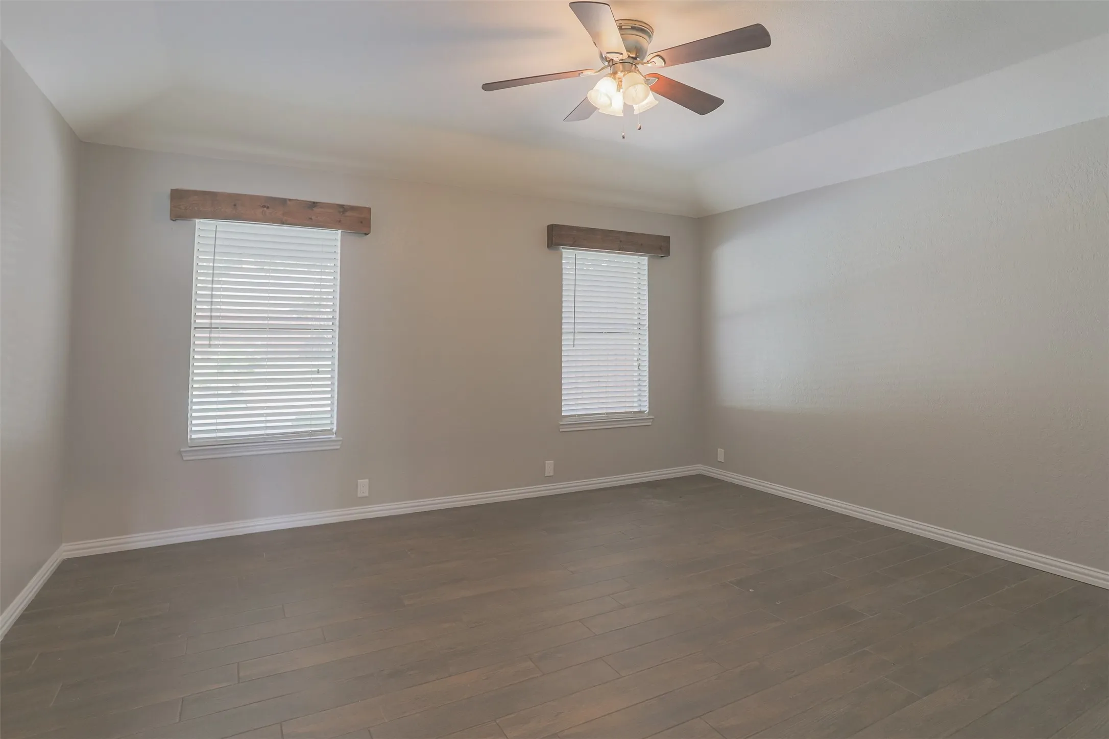 Bright and airy primary bedroom with a spacious, functional layout.