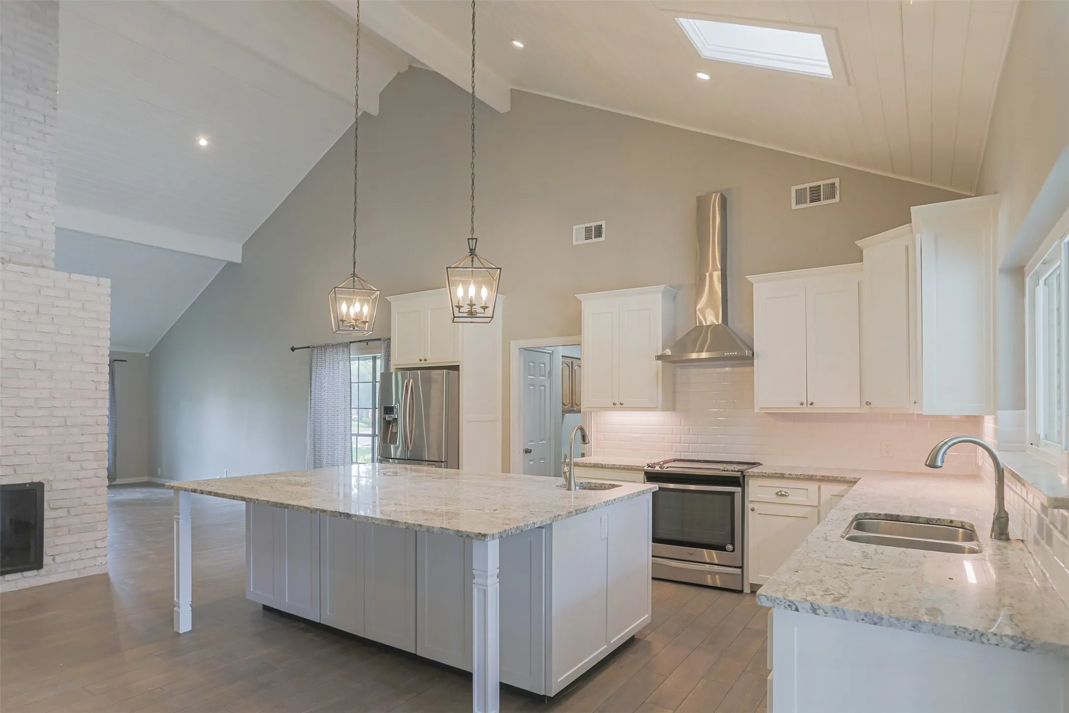 Spacious kitchen offering abundant storage and prep space.