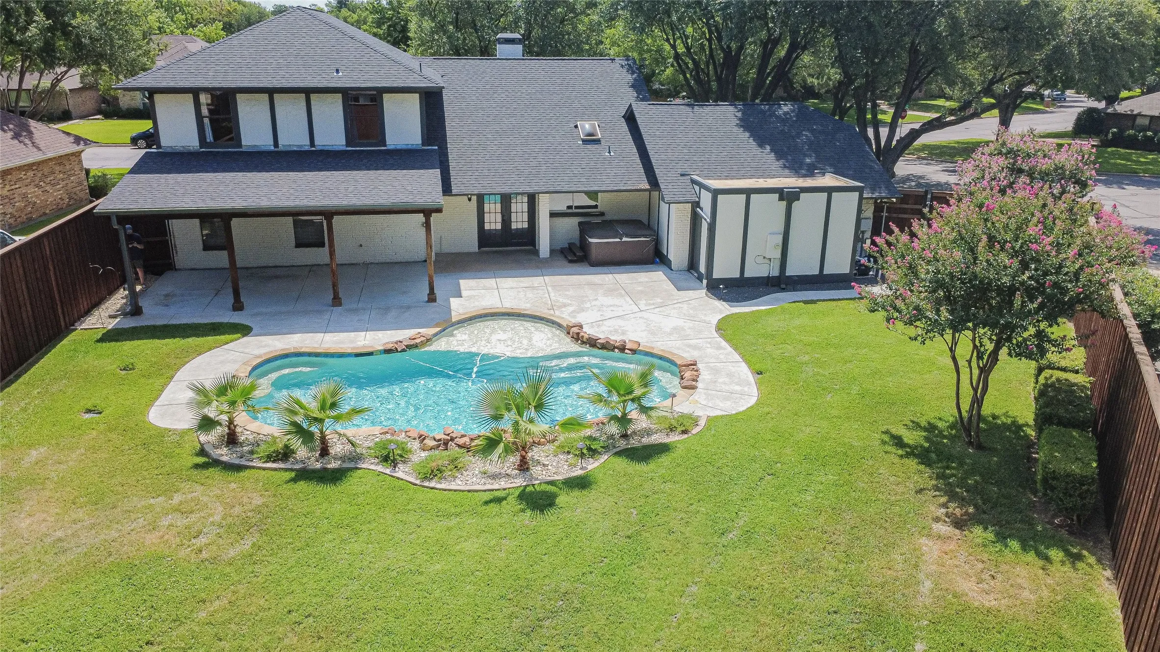 Dramatic aerial view showcasing the impressive outdoor entertaining space.