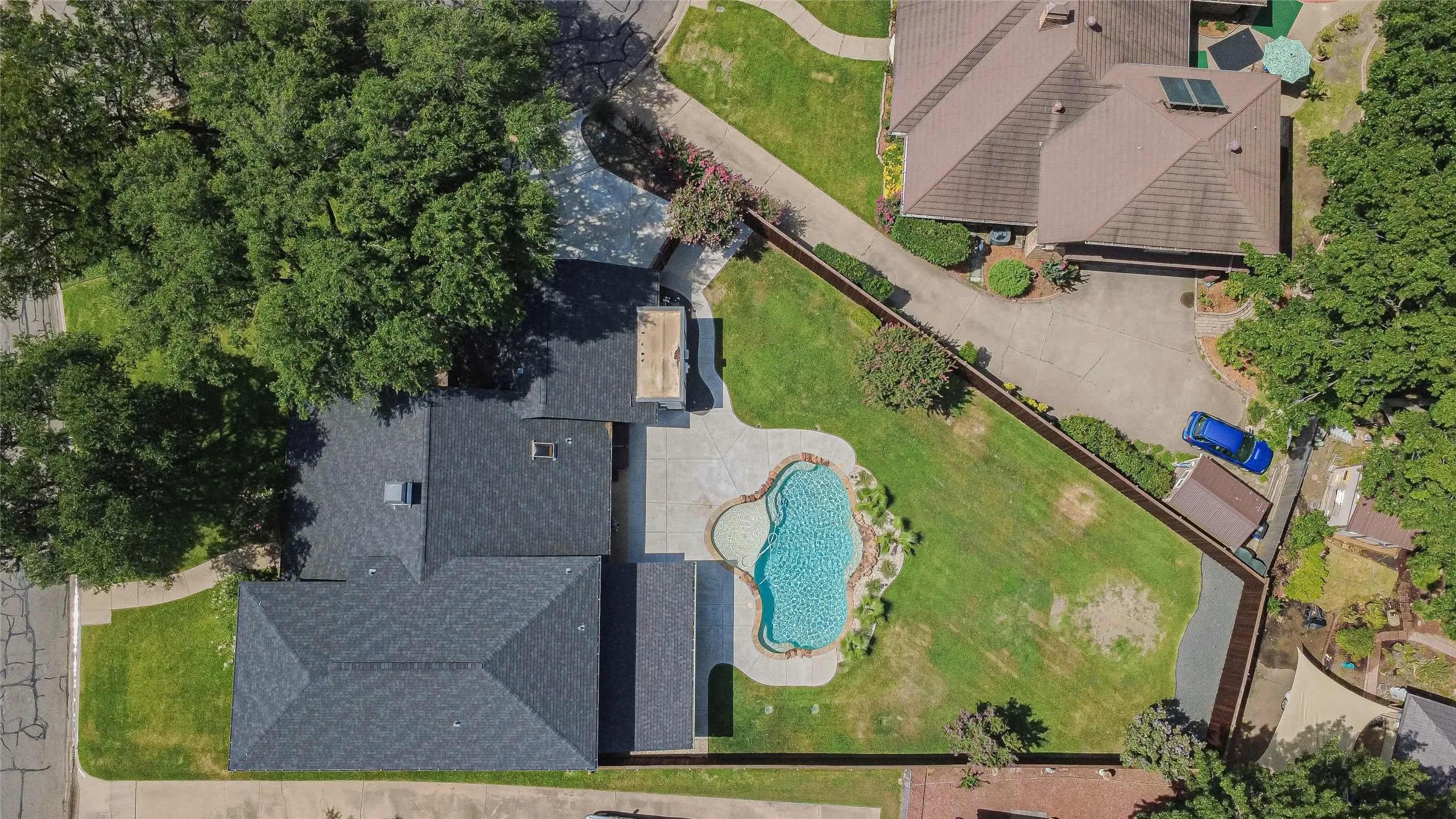 Overhead view showing pool, landscaping, and lot configuration.