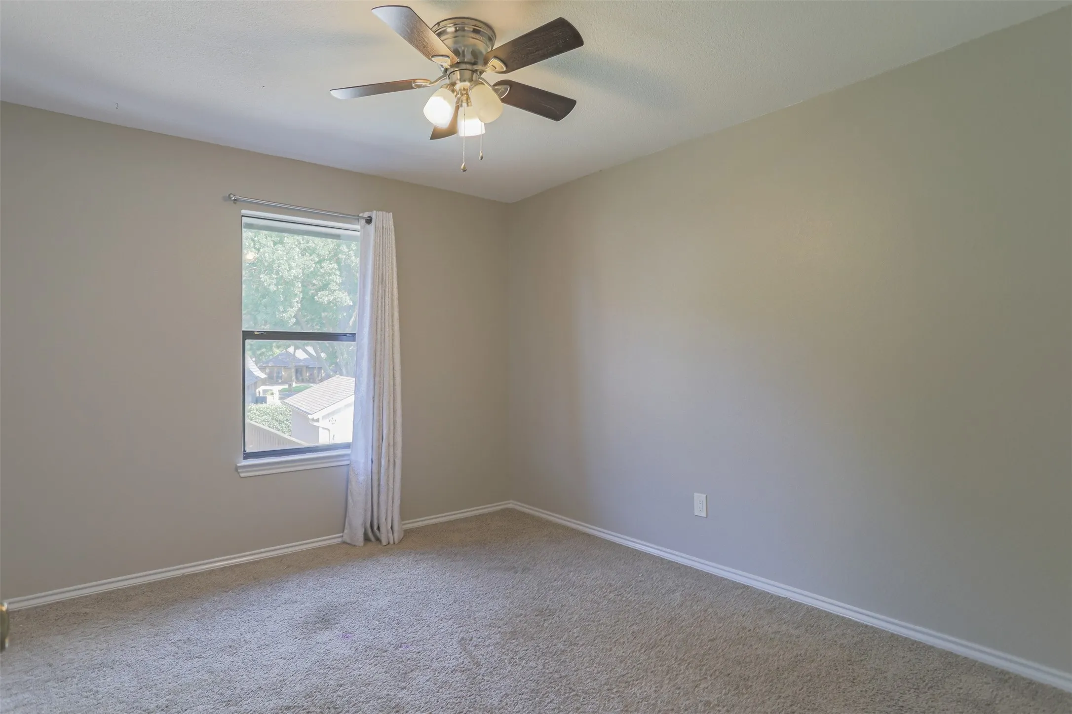 Upstairs bedroom offering a bright, inviting space with versatile functionality.