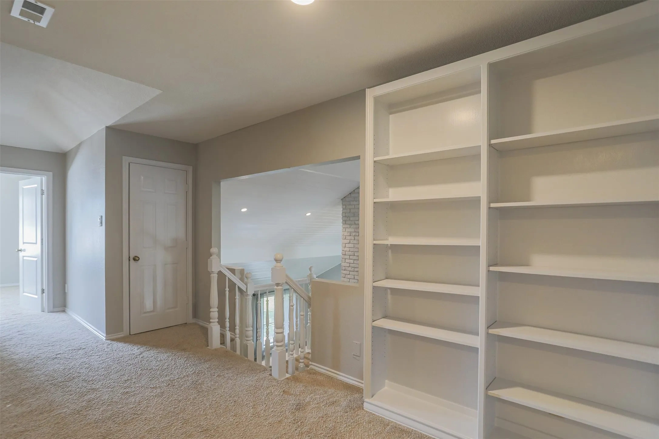 Upstairs hall with ample shelving/storage