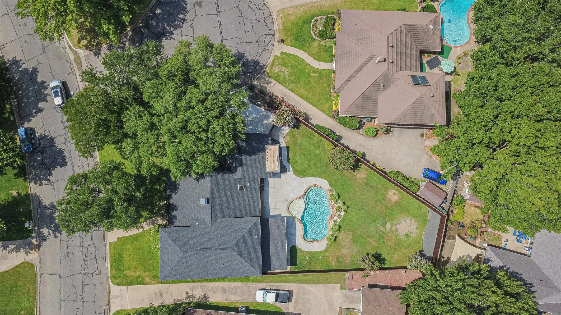 Overhead view showing pool, landscaping, and lot configuration.