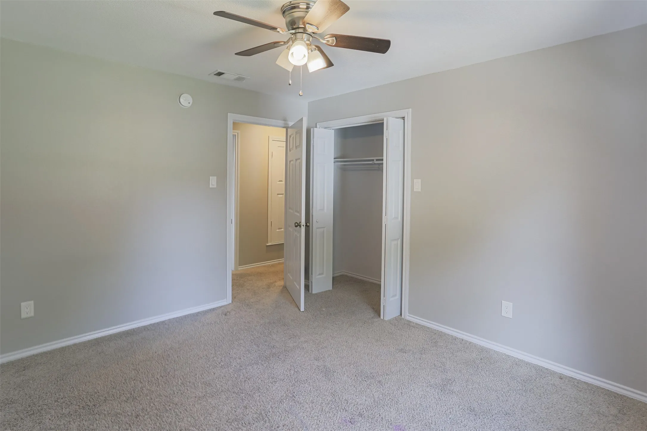 Upstairs bedroom offering a bright, inviting space with versatile functionality.