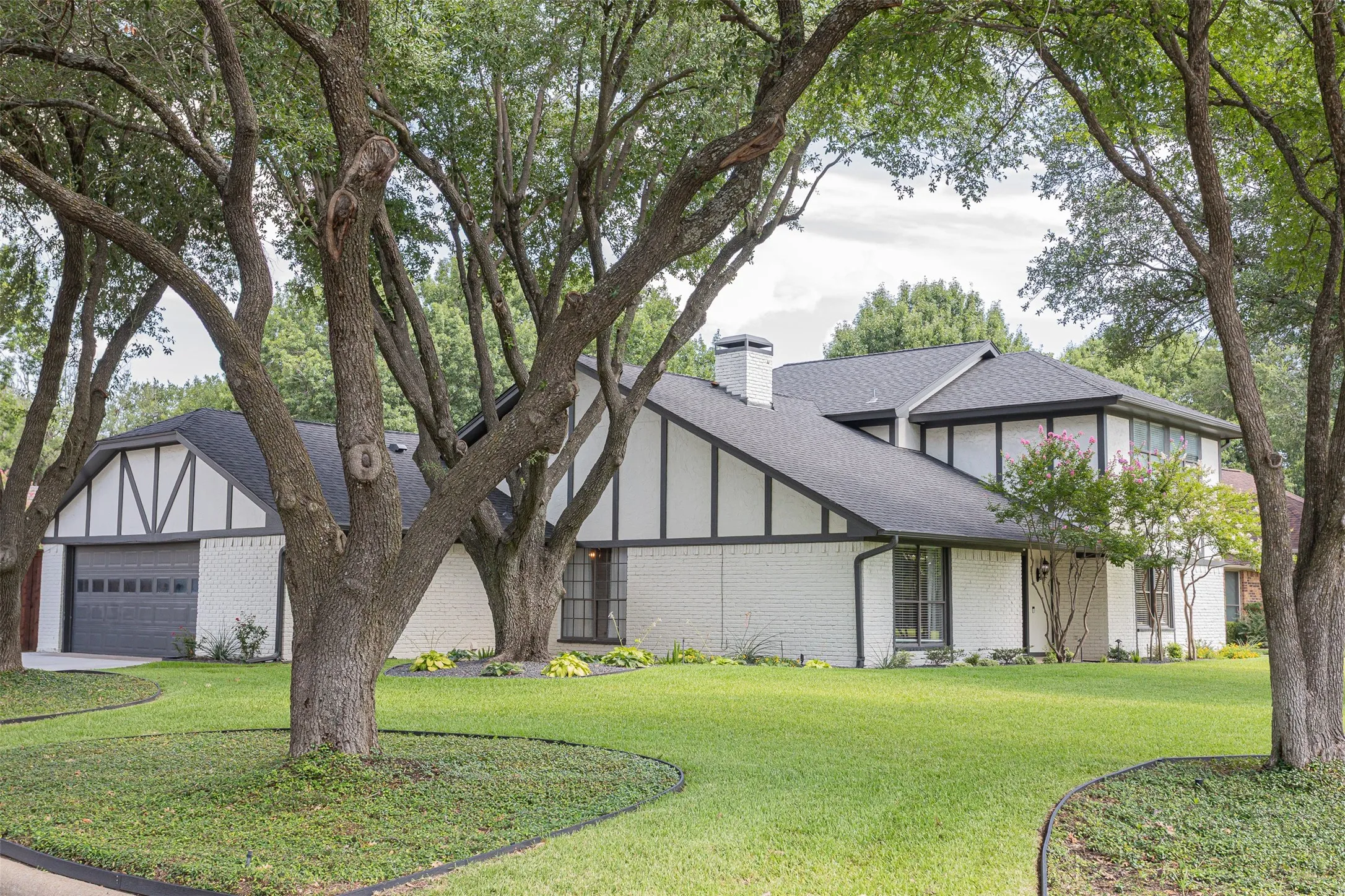 Mature shade trees frame the front lawn and create curb appeal.