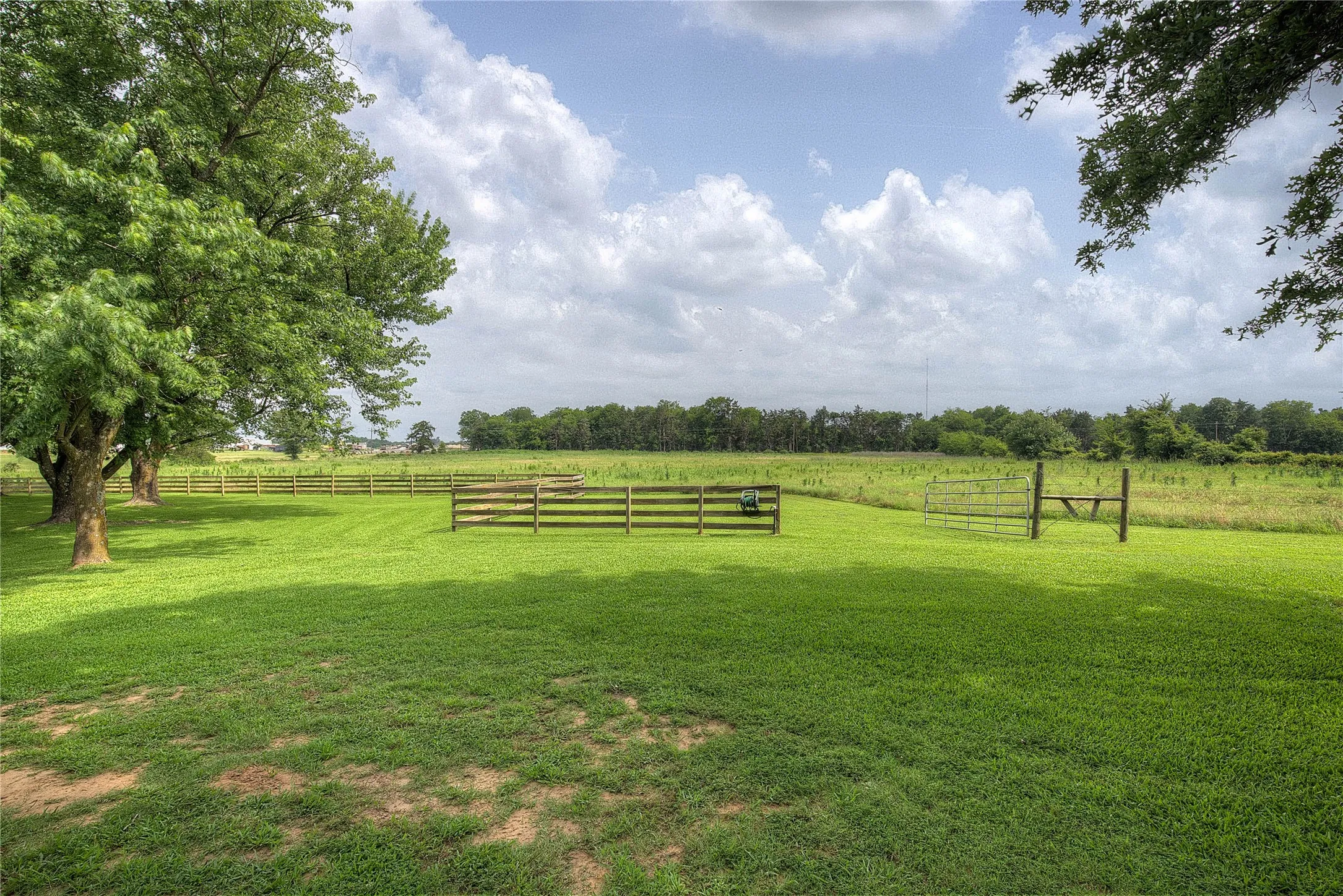 The remaining acreage has wire fencing and drive-through gates.