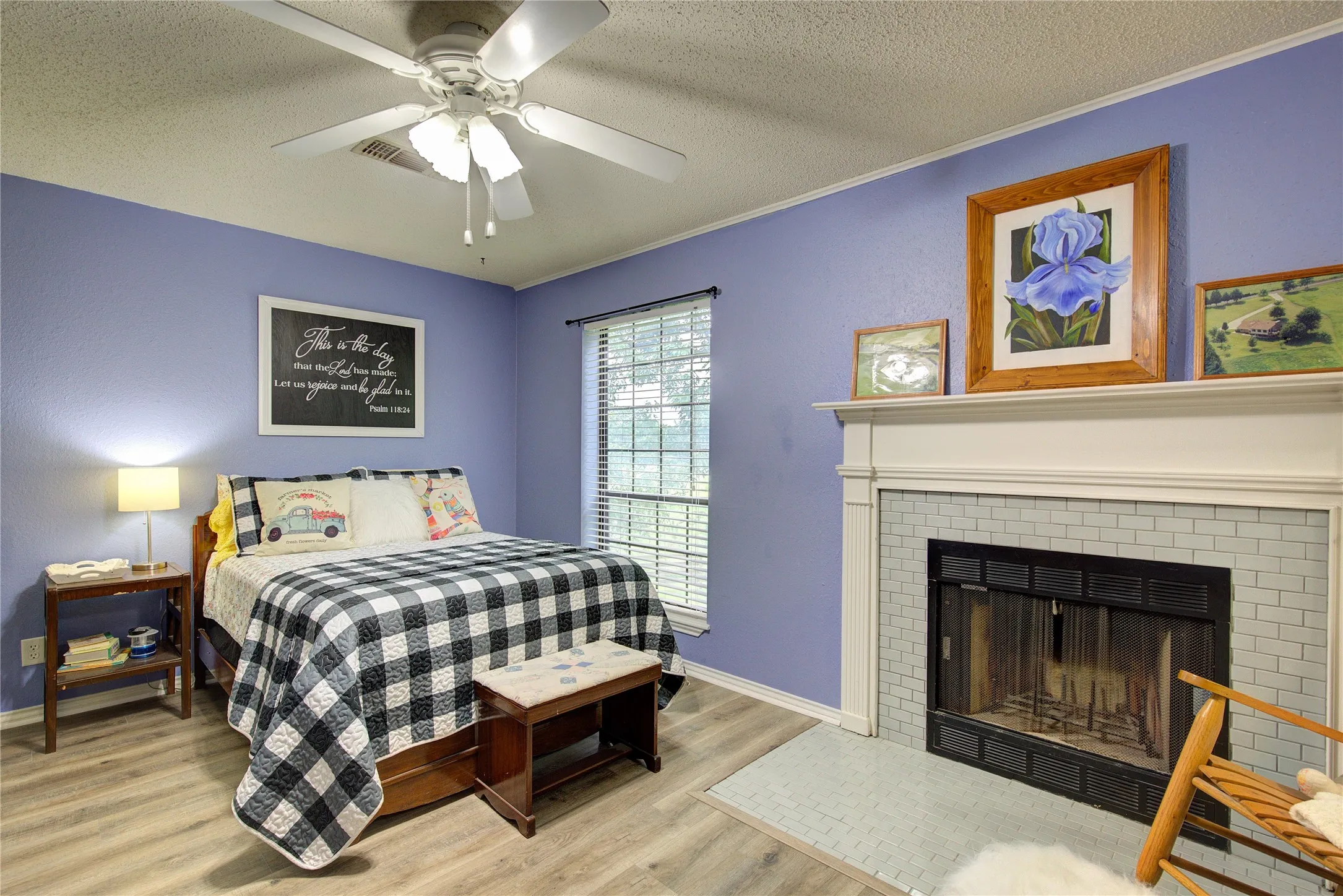 Bedroom 3 is also upstairs, and has its own tile surround wood-burning fireplace.