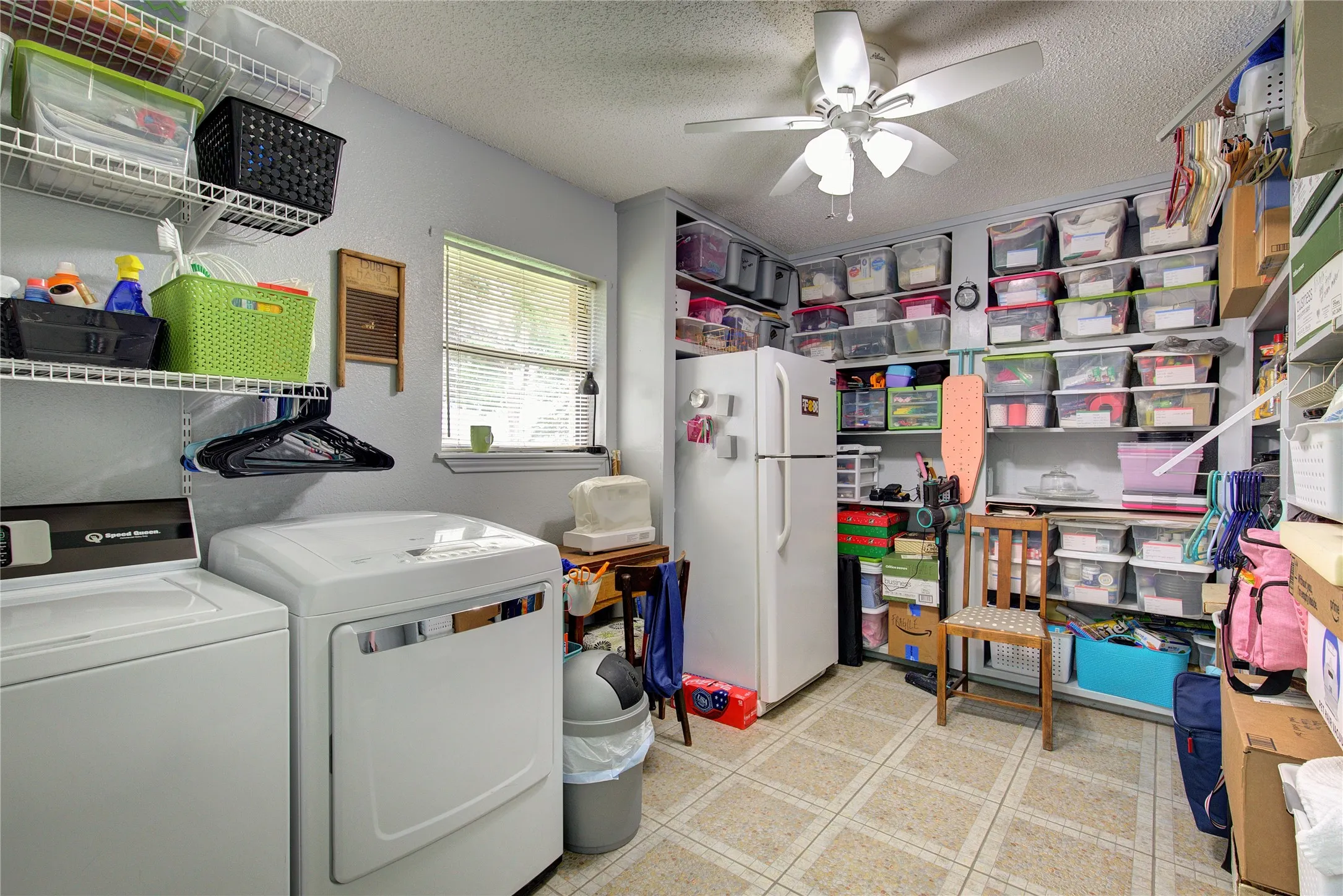 Utility has space for freezer, lots of shelving for overflow pantry or linen storage.