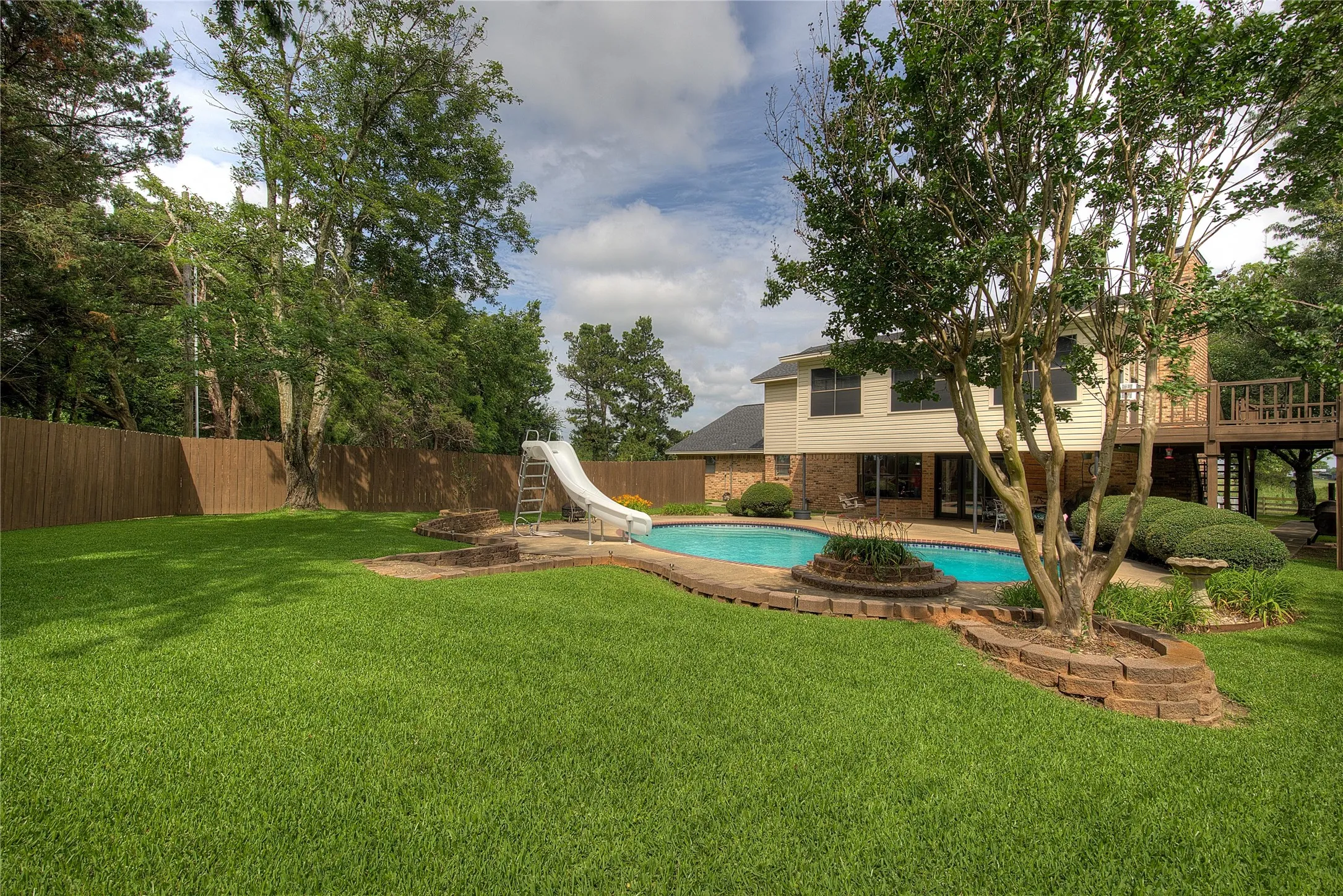 View of pool from back yard.  Look at all that lush St. Augustine!