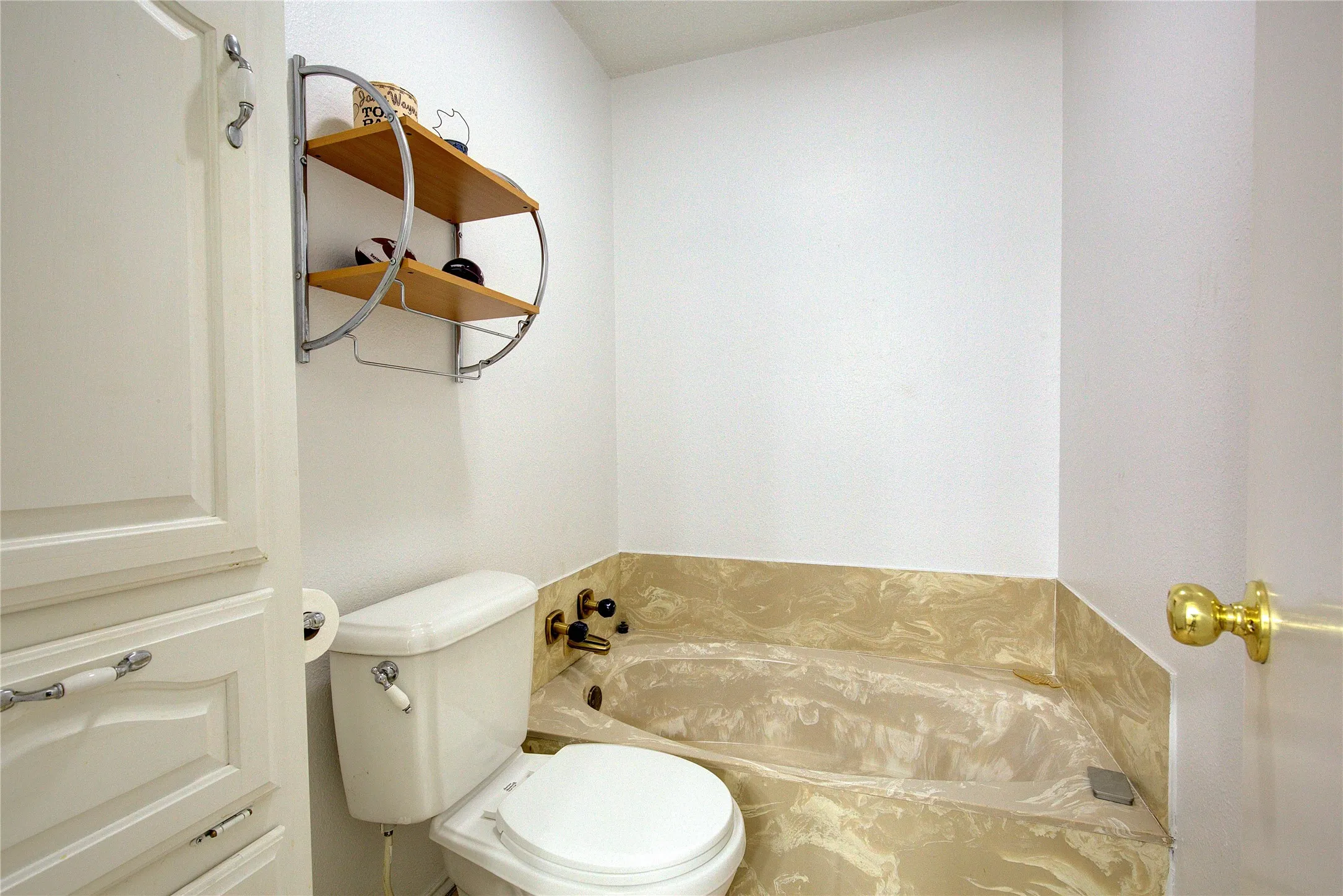 Downstairs primary ensuite has garden tub, linen closet.
