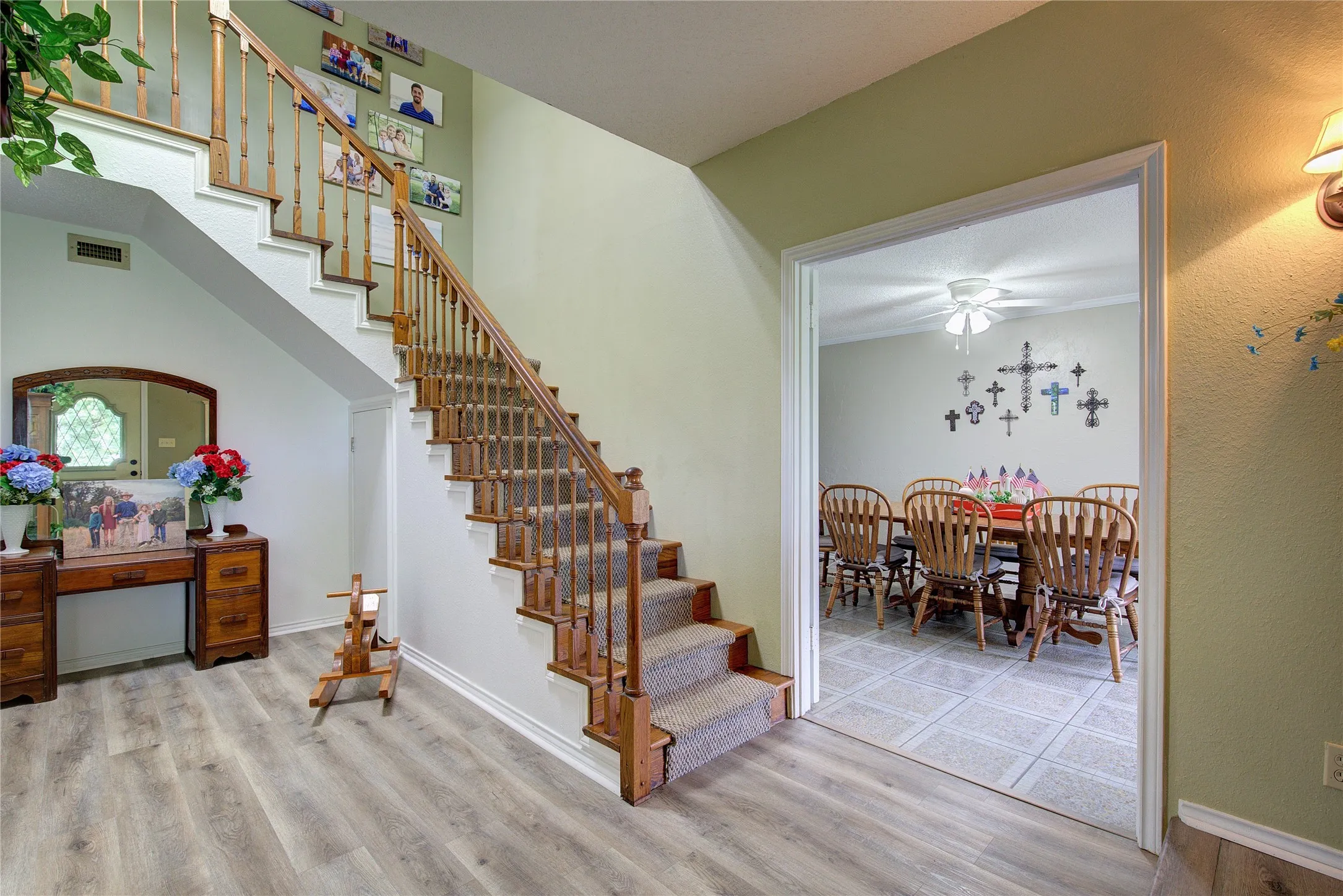 Foyer opens to dining room on one side and living room on the other.