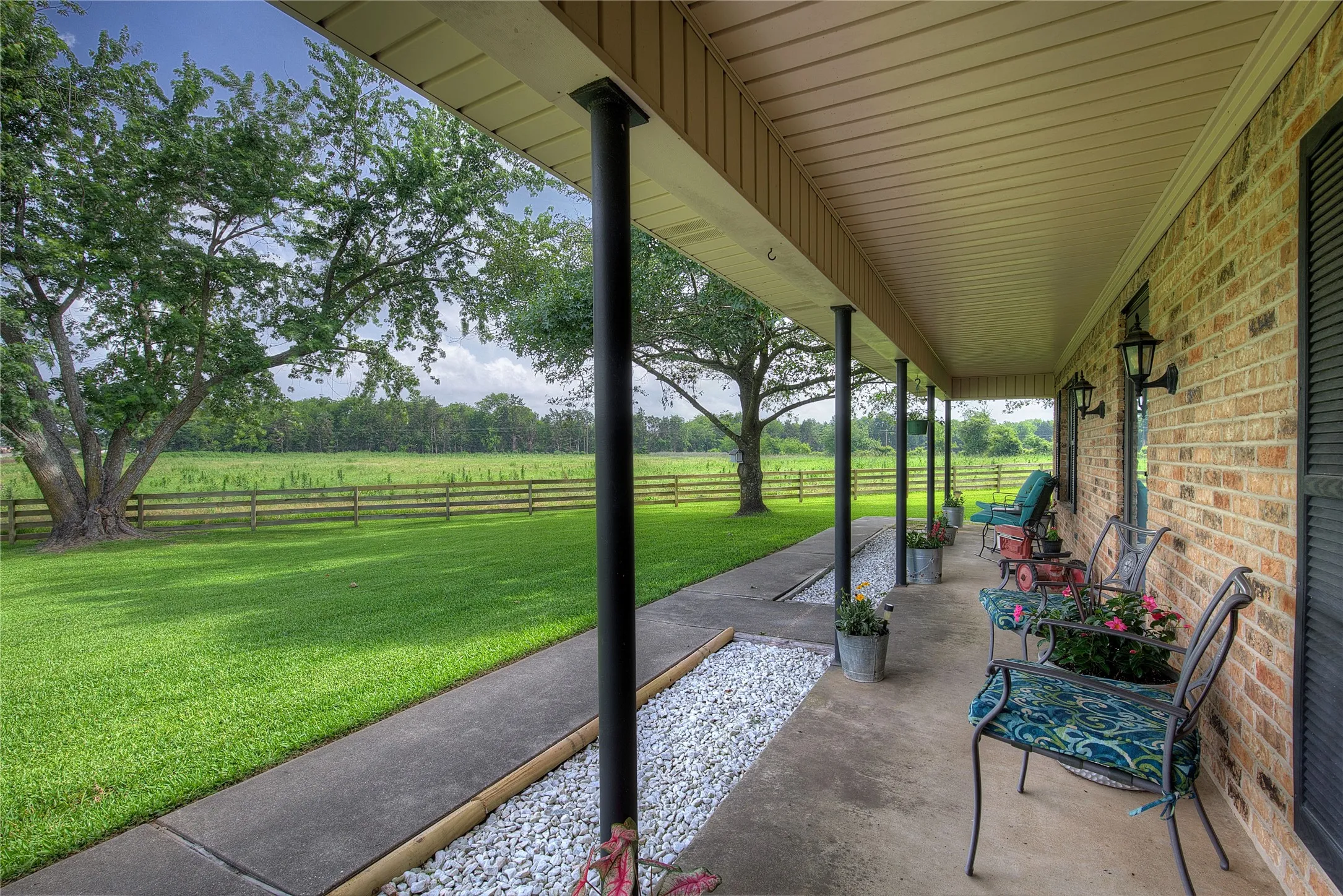 Sit on your front porch and admire the oak and magnolia trees!