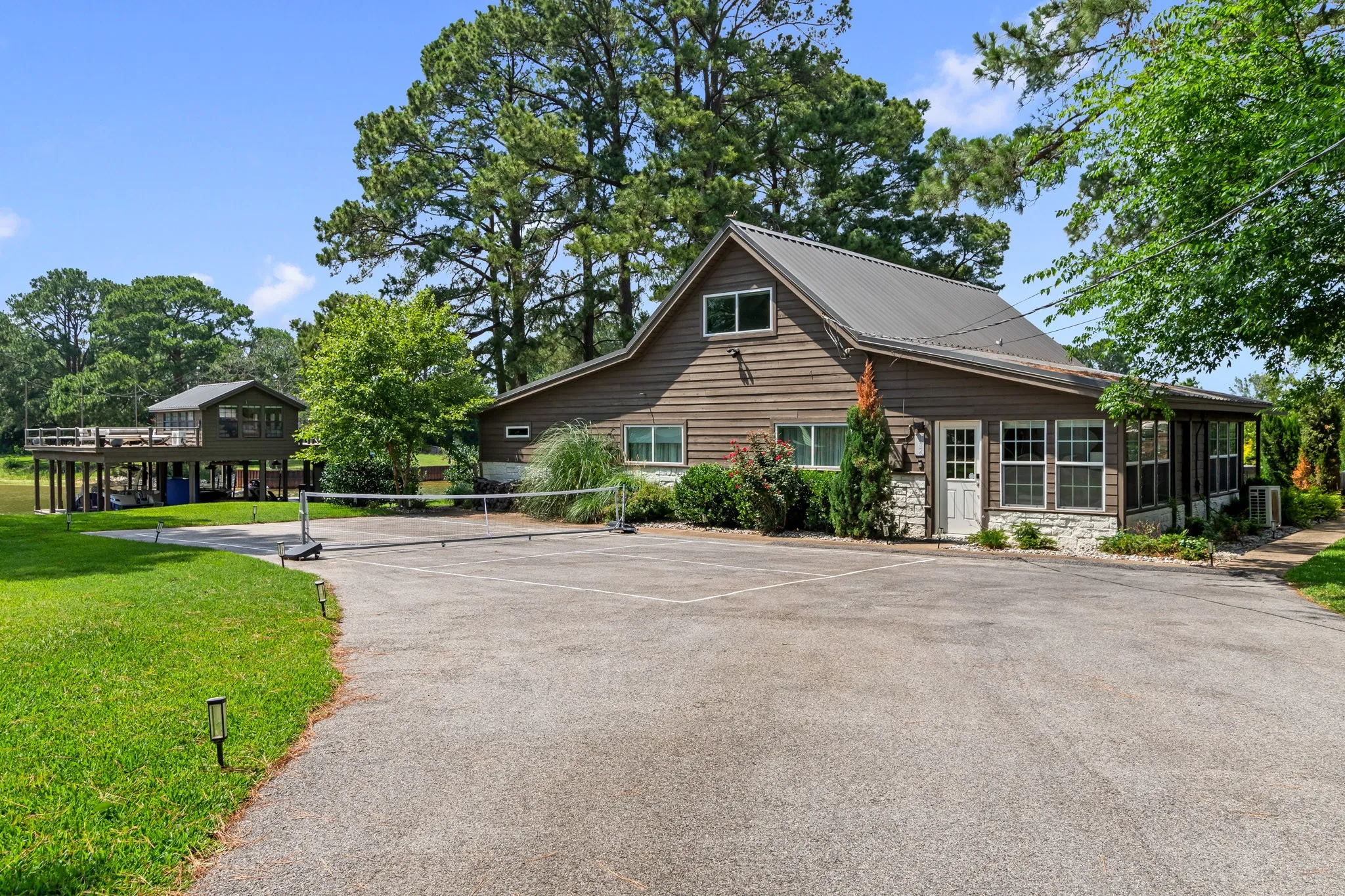 Driveway Features Pickleball Court Layout with Removable Net for Additional Parking