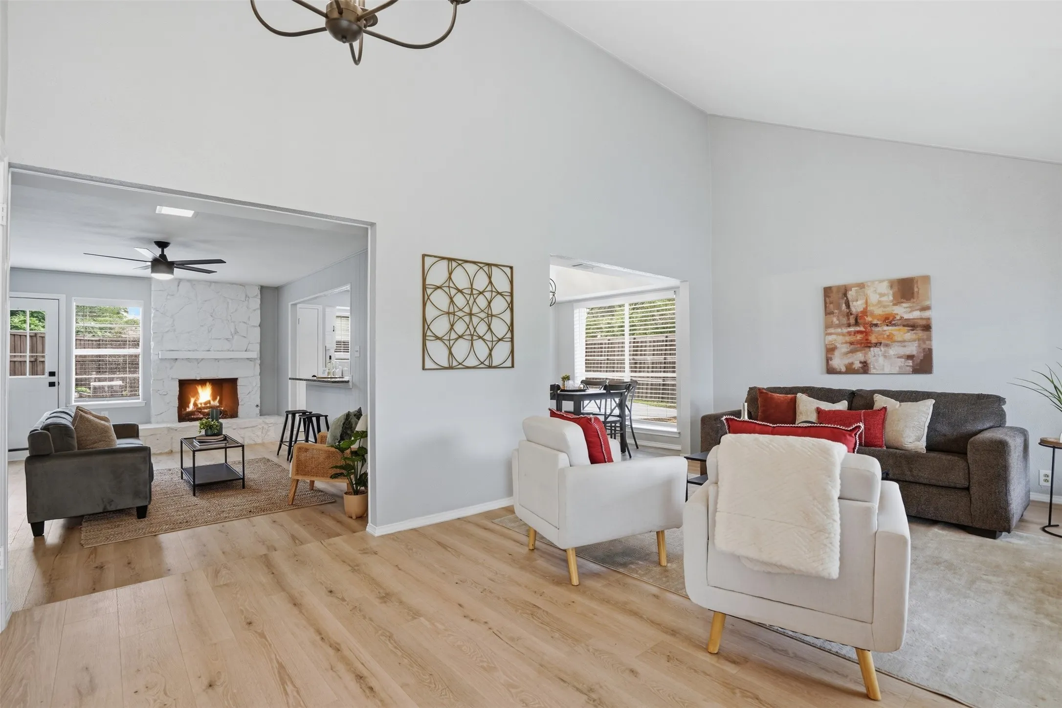 Vaulted ceilings highlight the main living area with wood-finish flooring