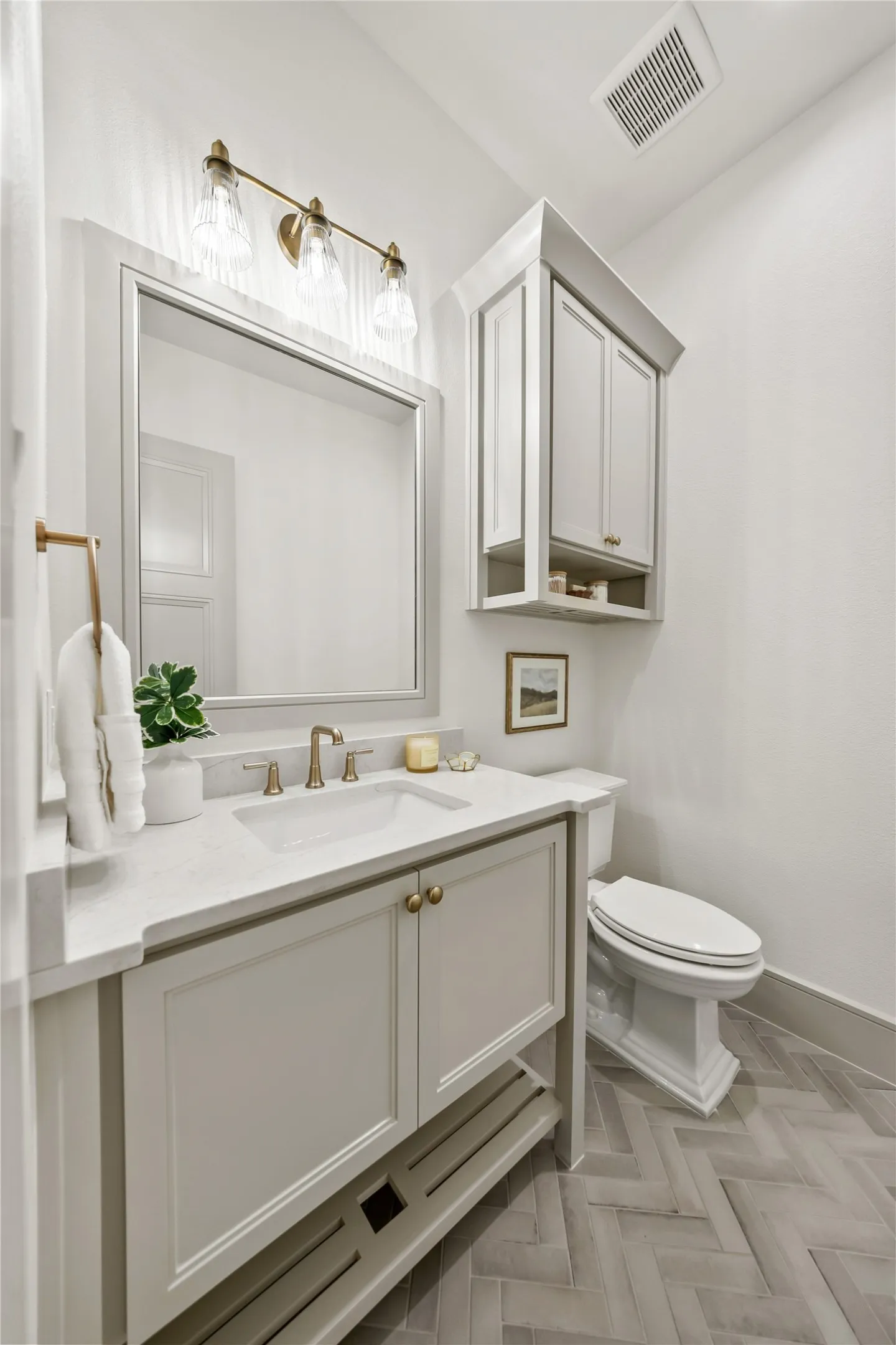 Bathroom vanity featuring a white rectangular undermount sink and a light-toned​​‌​​​​‌​​‌‌​‌‌​​​‌‌​‌​‌​‌​​​‌​​ countertop