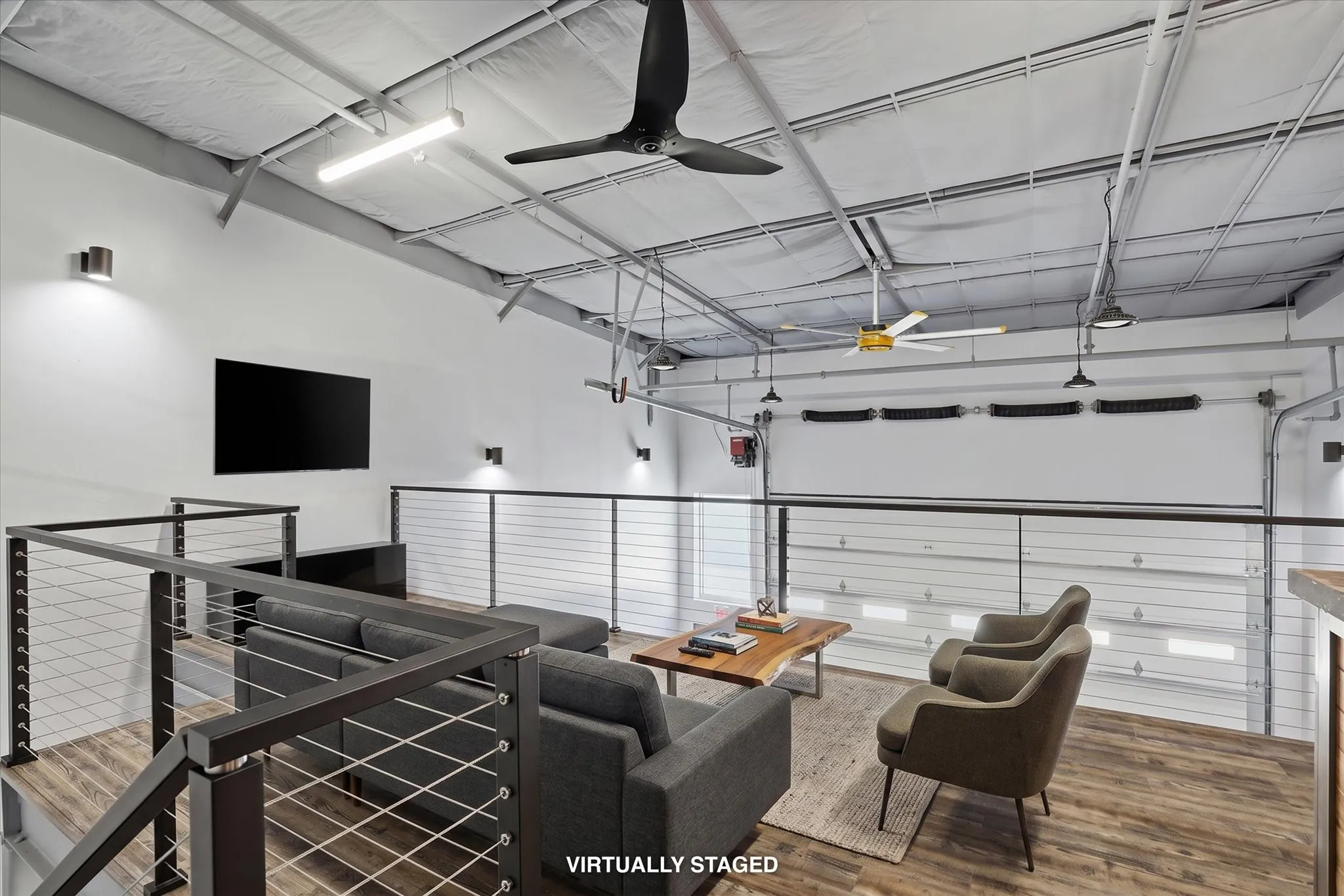 Loft mezzanine built for entertaining (virtually staged with furniture)