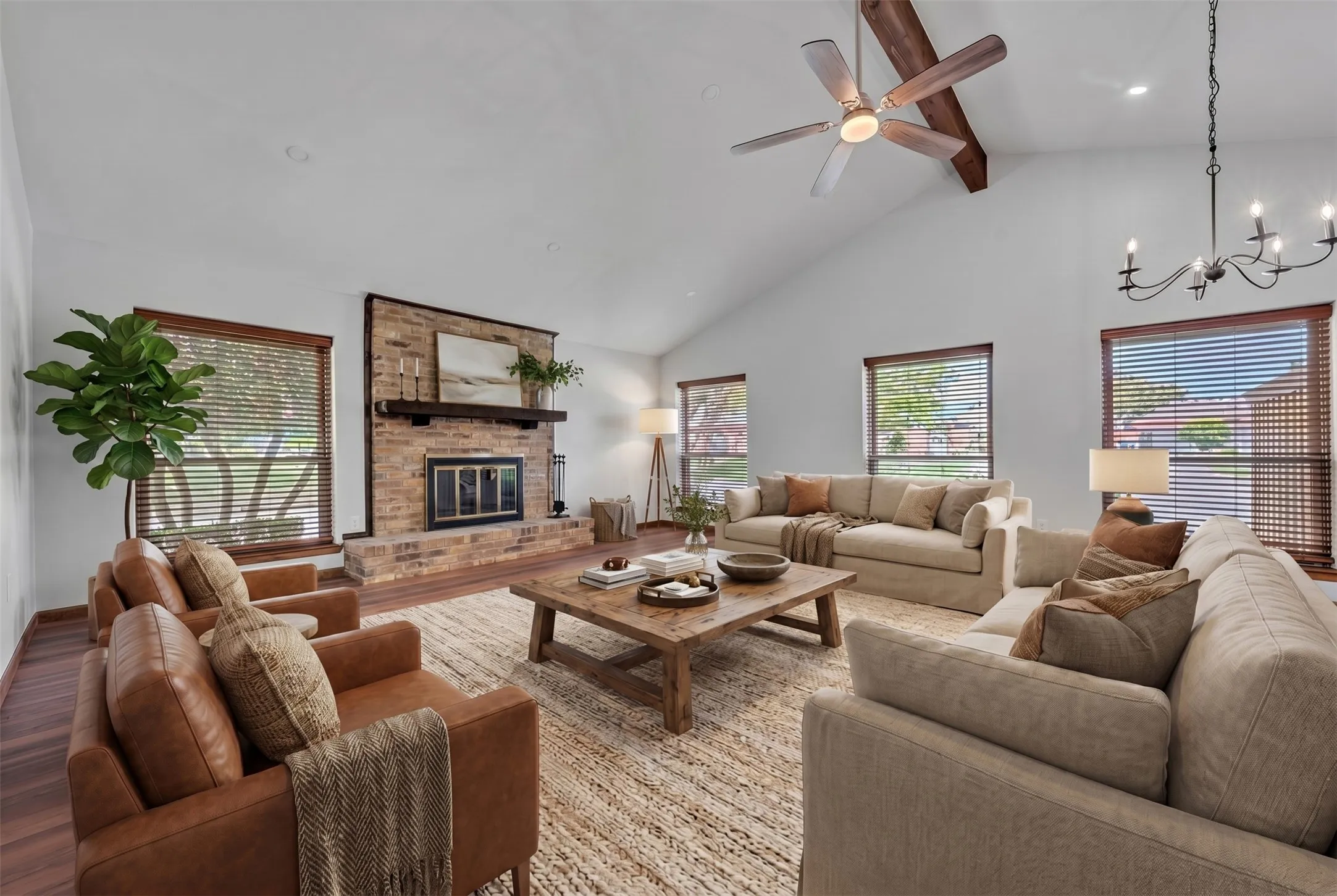 Virtually staged. Vaulted ceilings, LVP flooring throughout and wood burning fireplace.