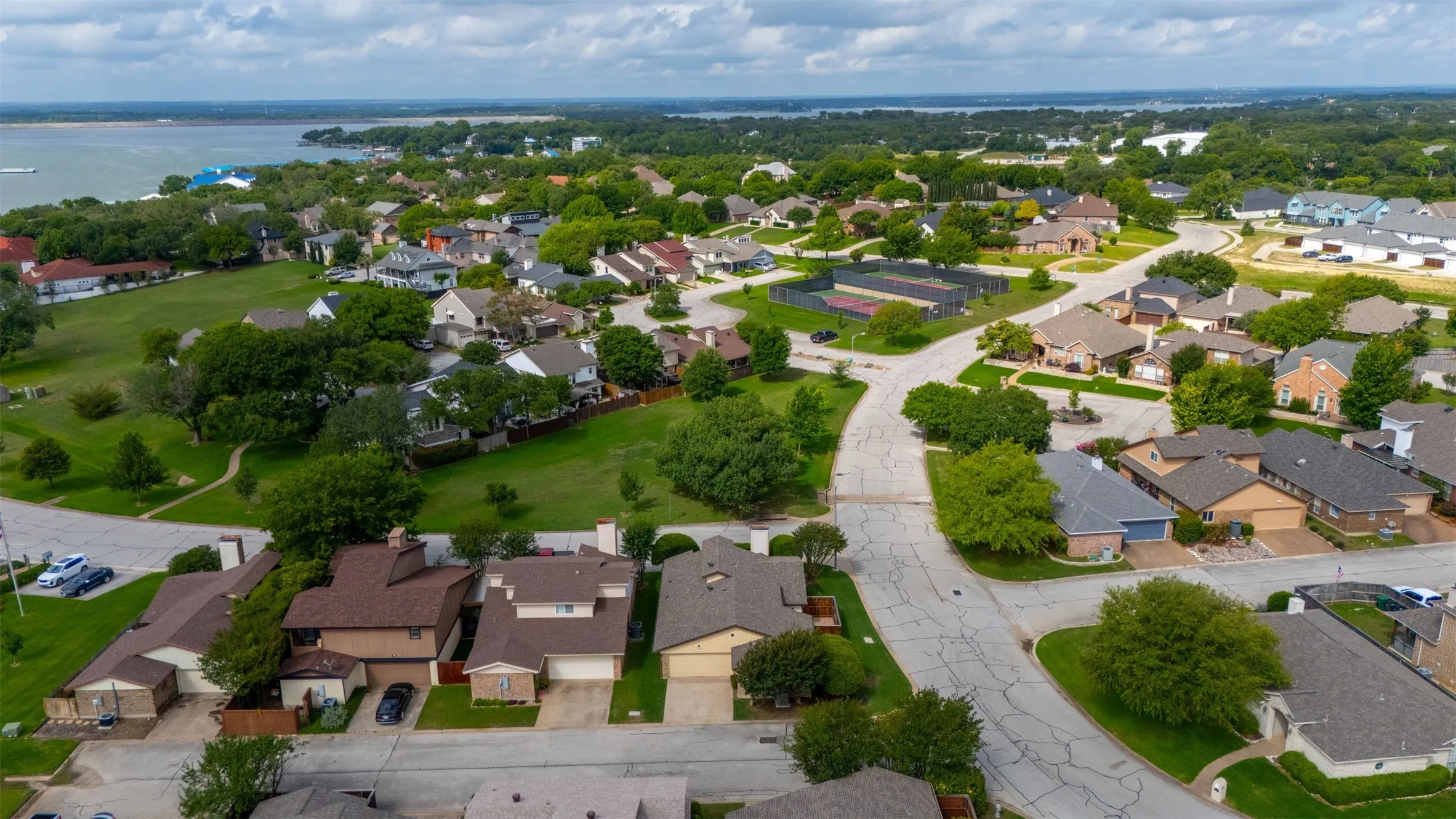Front property views are to greenspace and lake.