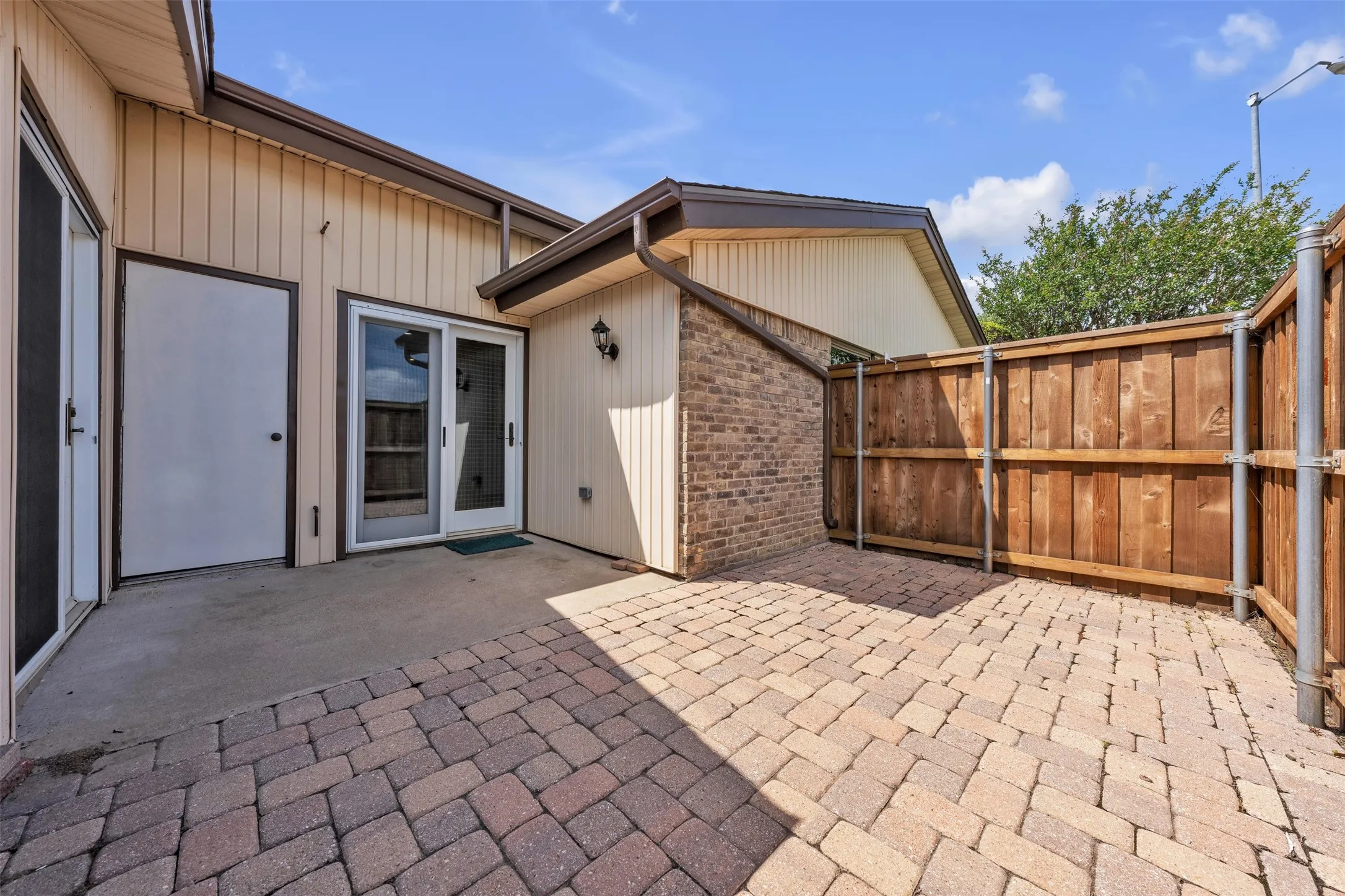Side patio has storage area.
