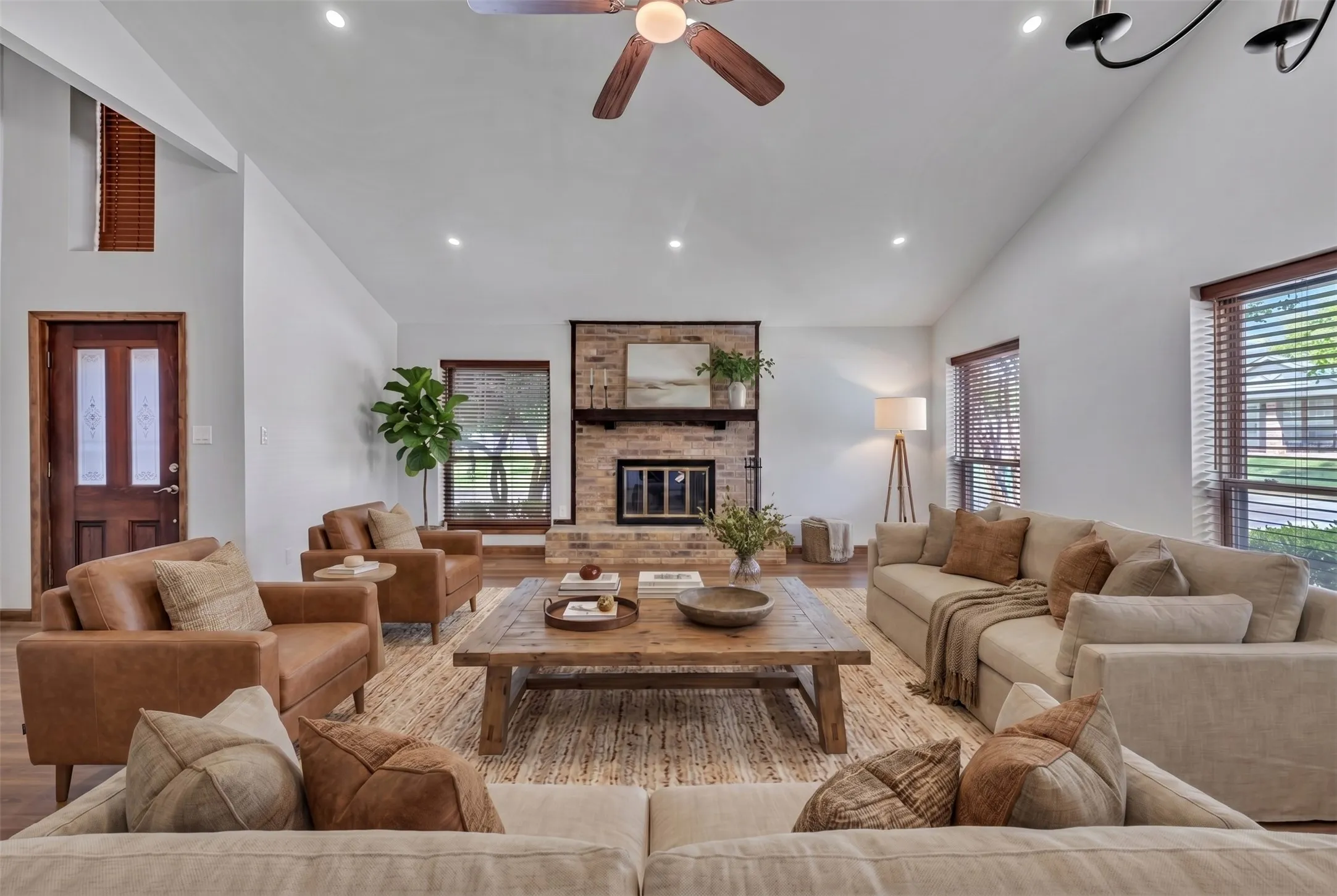 Woodlike window coverings throughout the home.