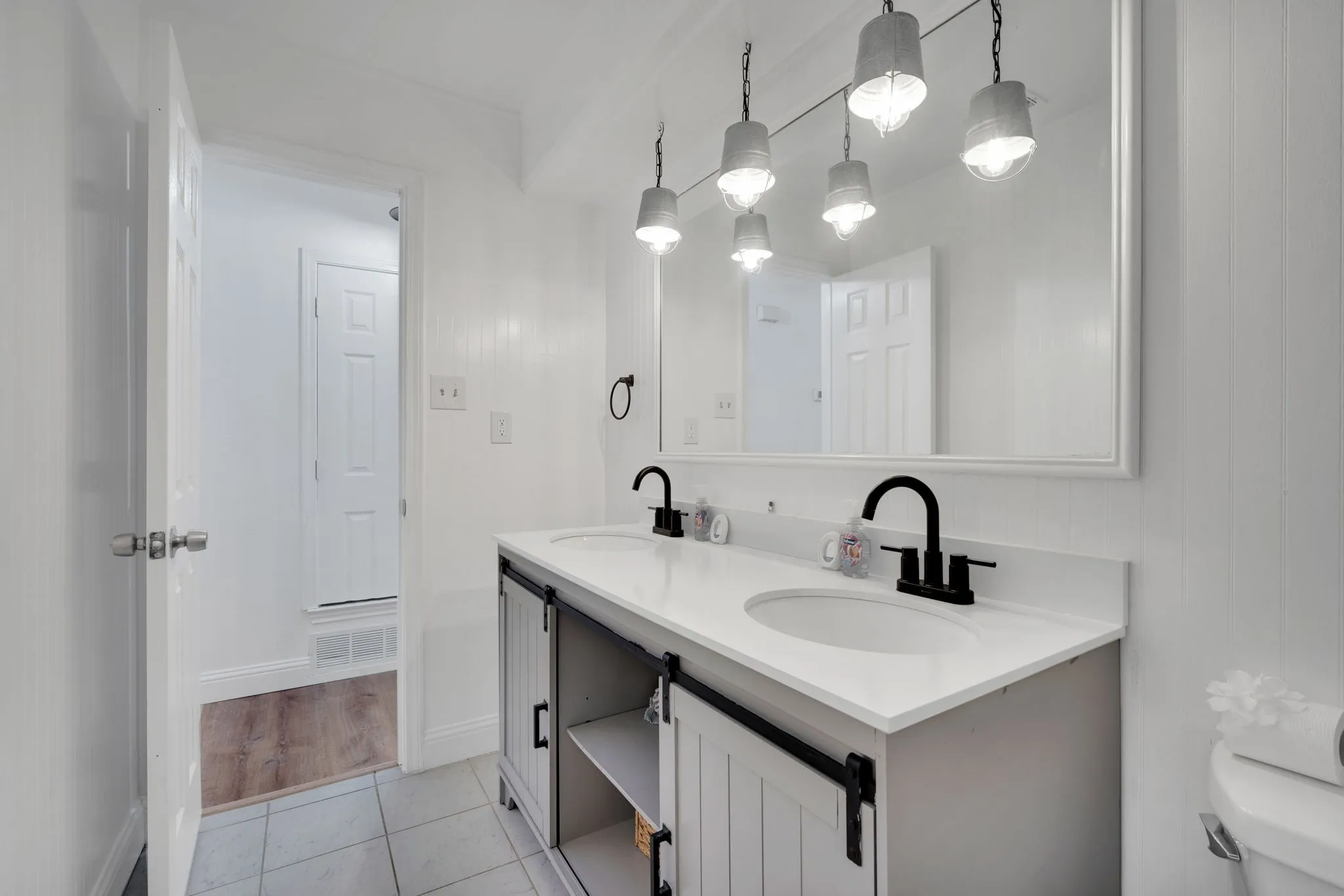 Double vanity with white countertop and integrated sinks