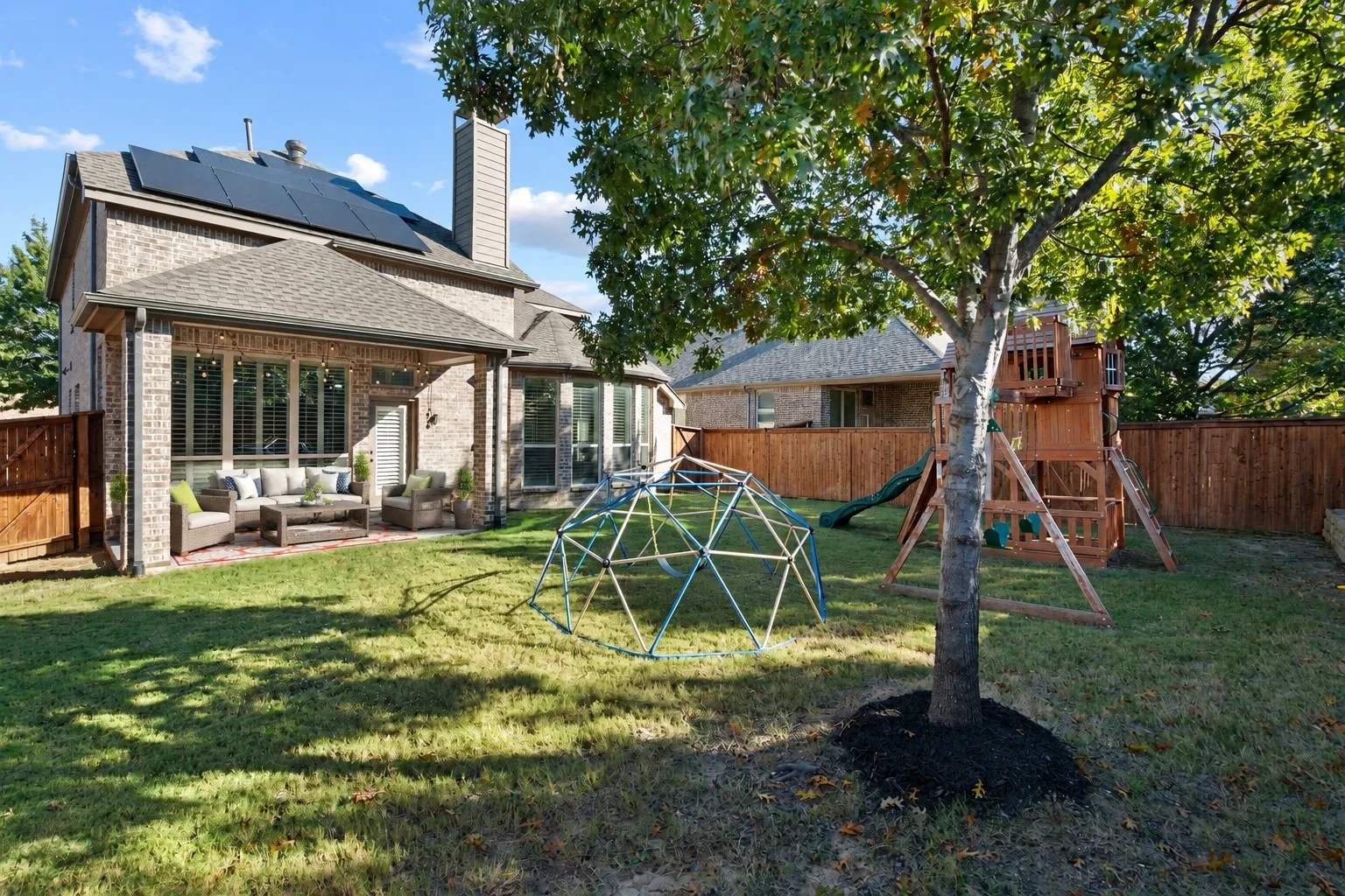 Spacious backyard with covered patio