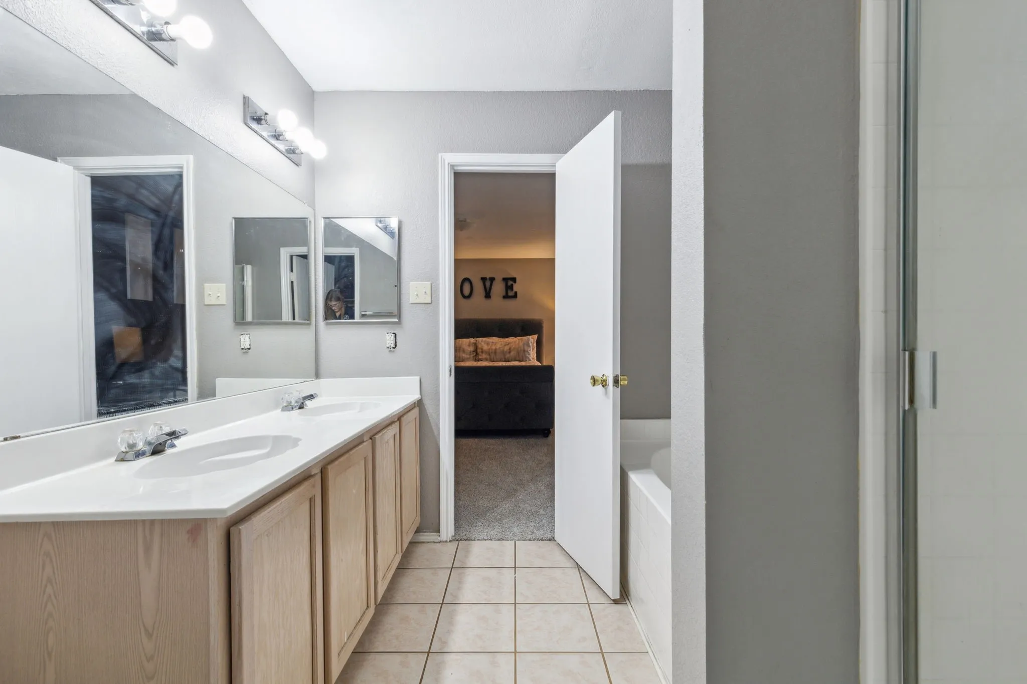 Primary bathroom is also equipped with a separate shower and garden tub.