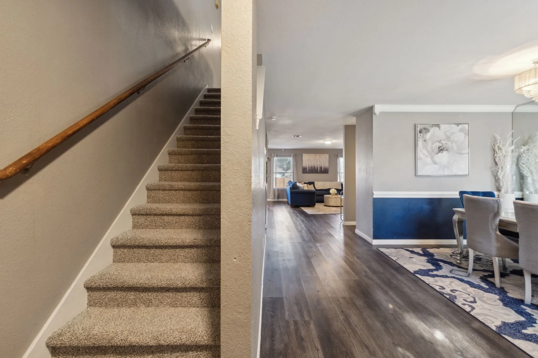 A nice shot of the gorgeous flooring on the first floor, and the newly installed carpet going up to the second floor.