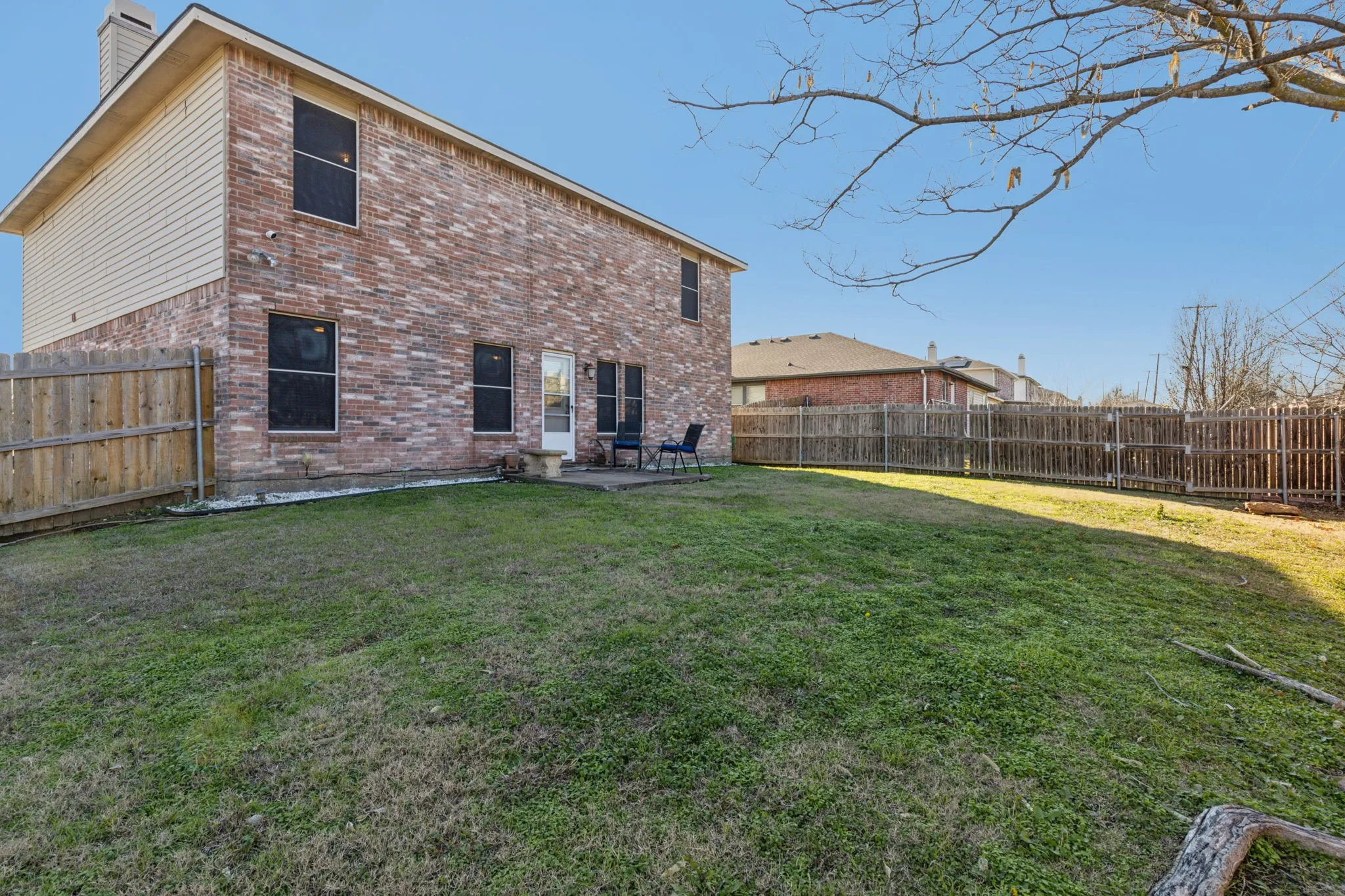Another view of the back exterior and the huge backyard.