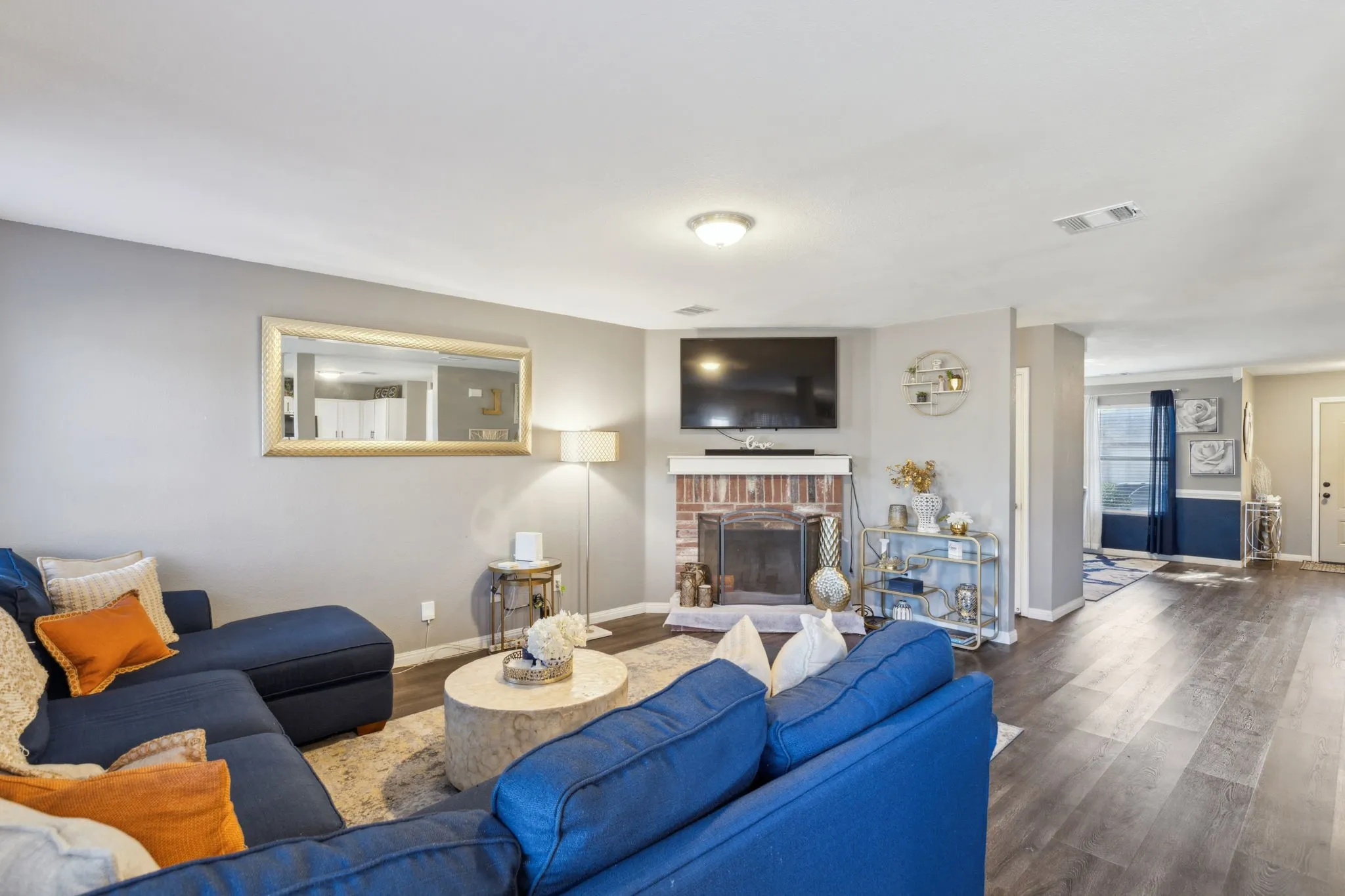 Stunning woodflooring, neutral palette and a wood-burning fireplace.
