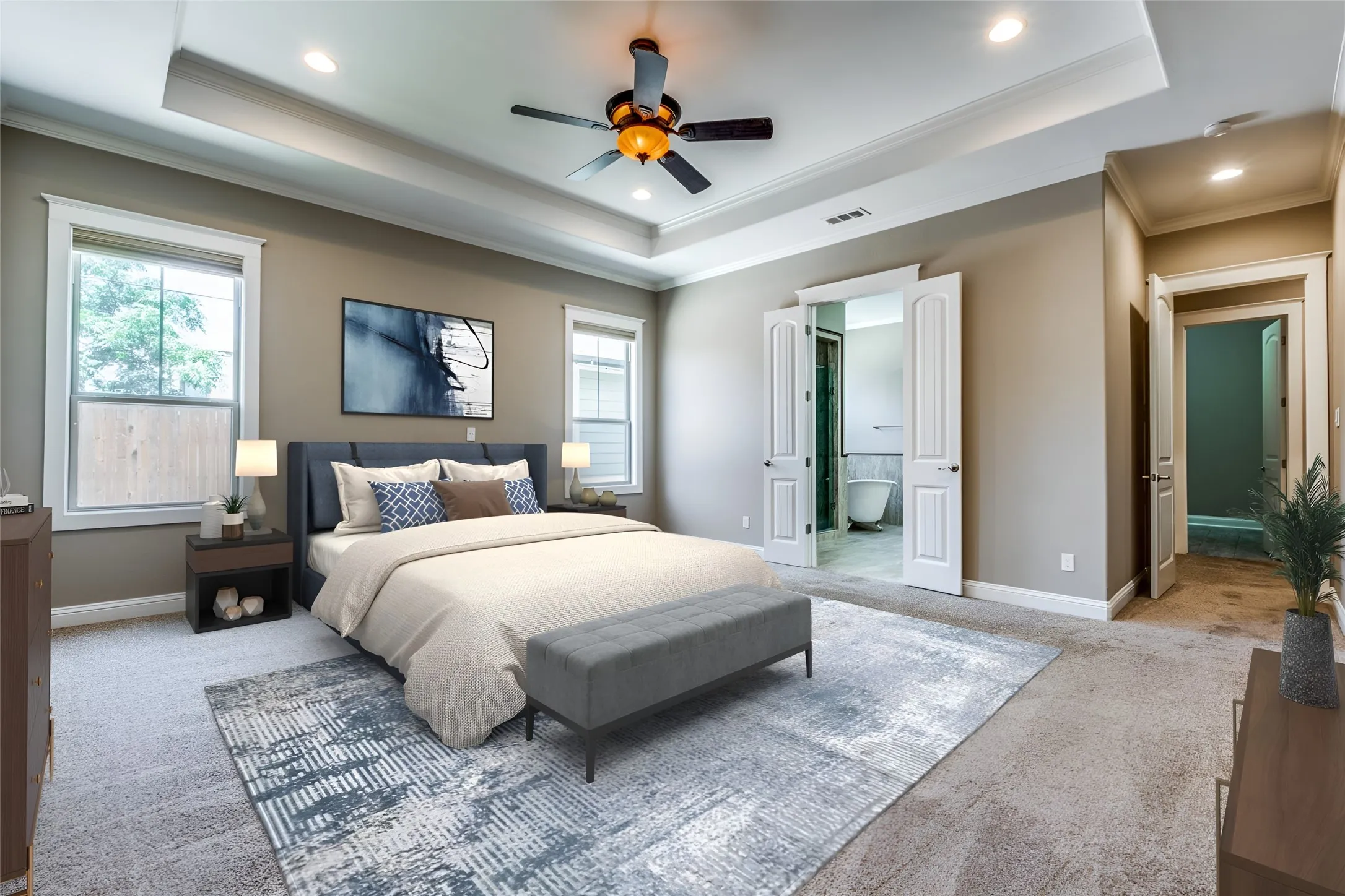 Tray ceiling with recessed lighting and crown molding