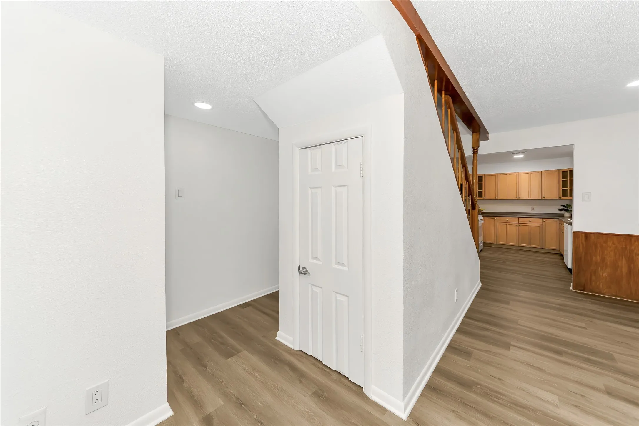 Coat closet under stairs