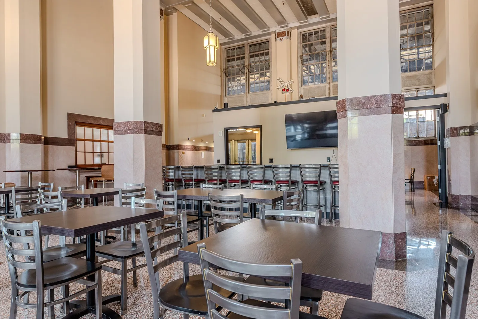 Spacious interior with high ceilings and decorative architectural columns