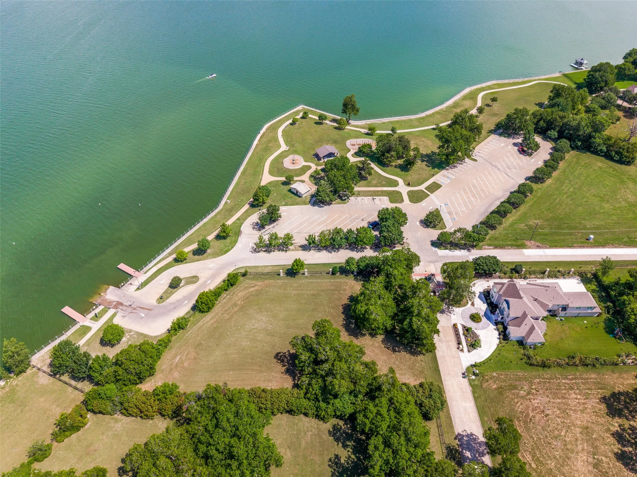 Aerial perspective-Terry Park boat ramp showcasing a waterfront park with boat ramps and a large parking area