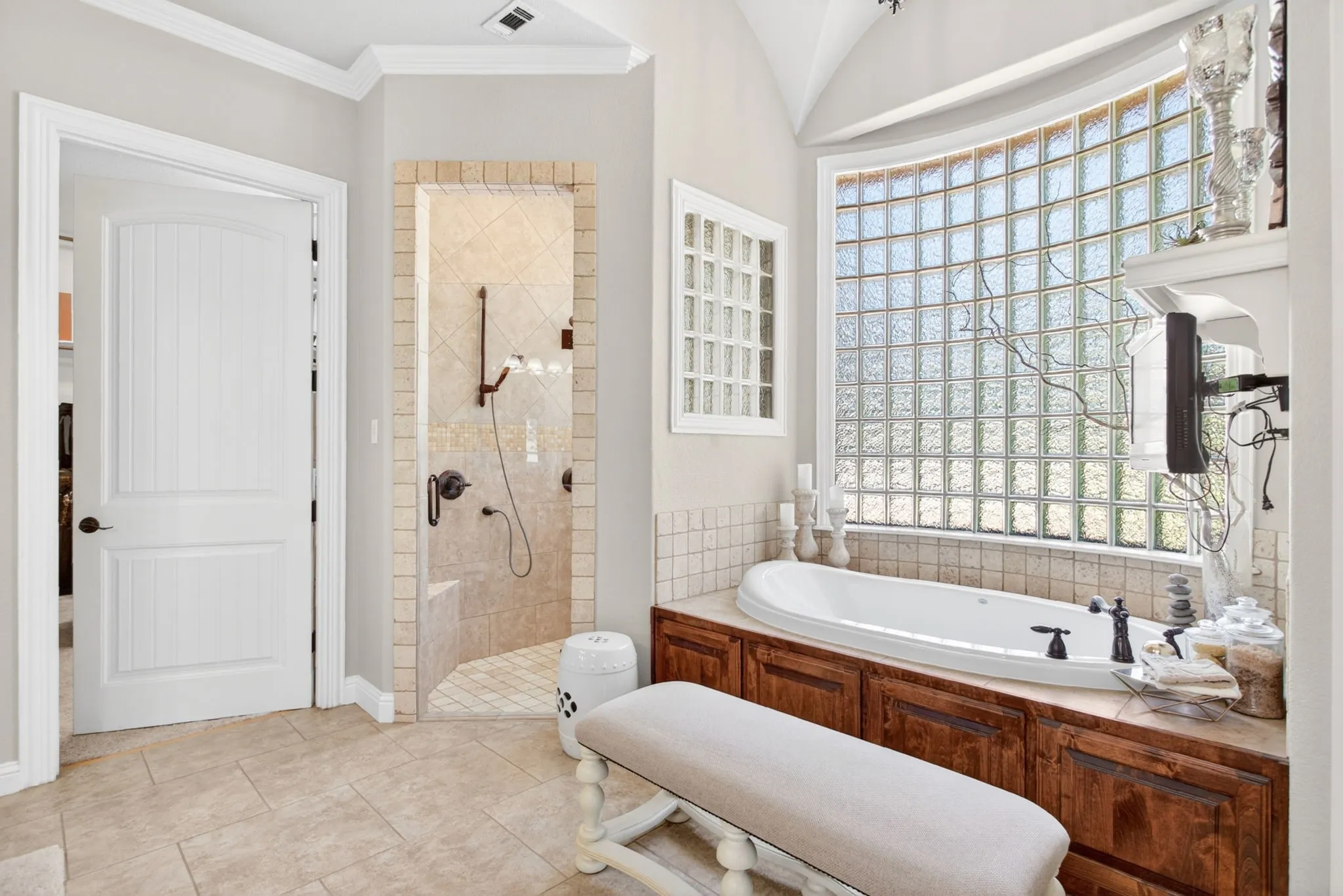 Primary ensuite bathroom with soaking tub and a large walk in shower.