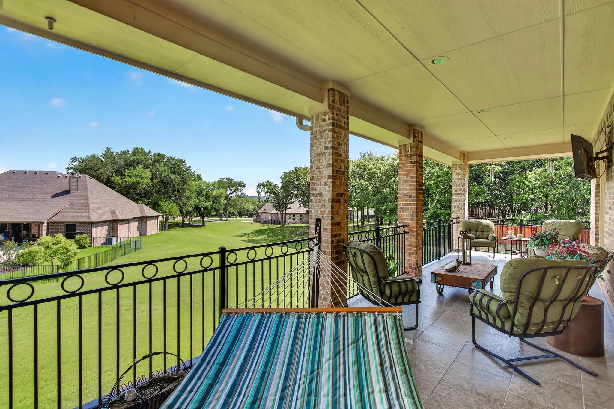 This balcony off the upstairs living space is the perfect place to relax.