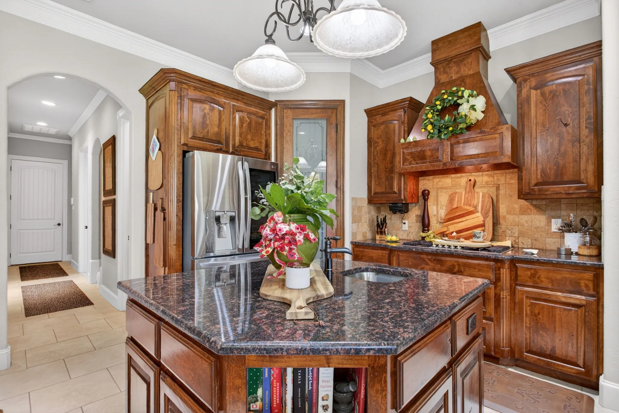 Custom cabinetry and a gas cooktop.