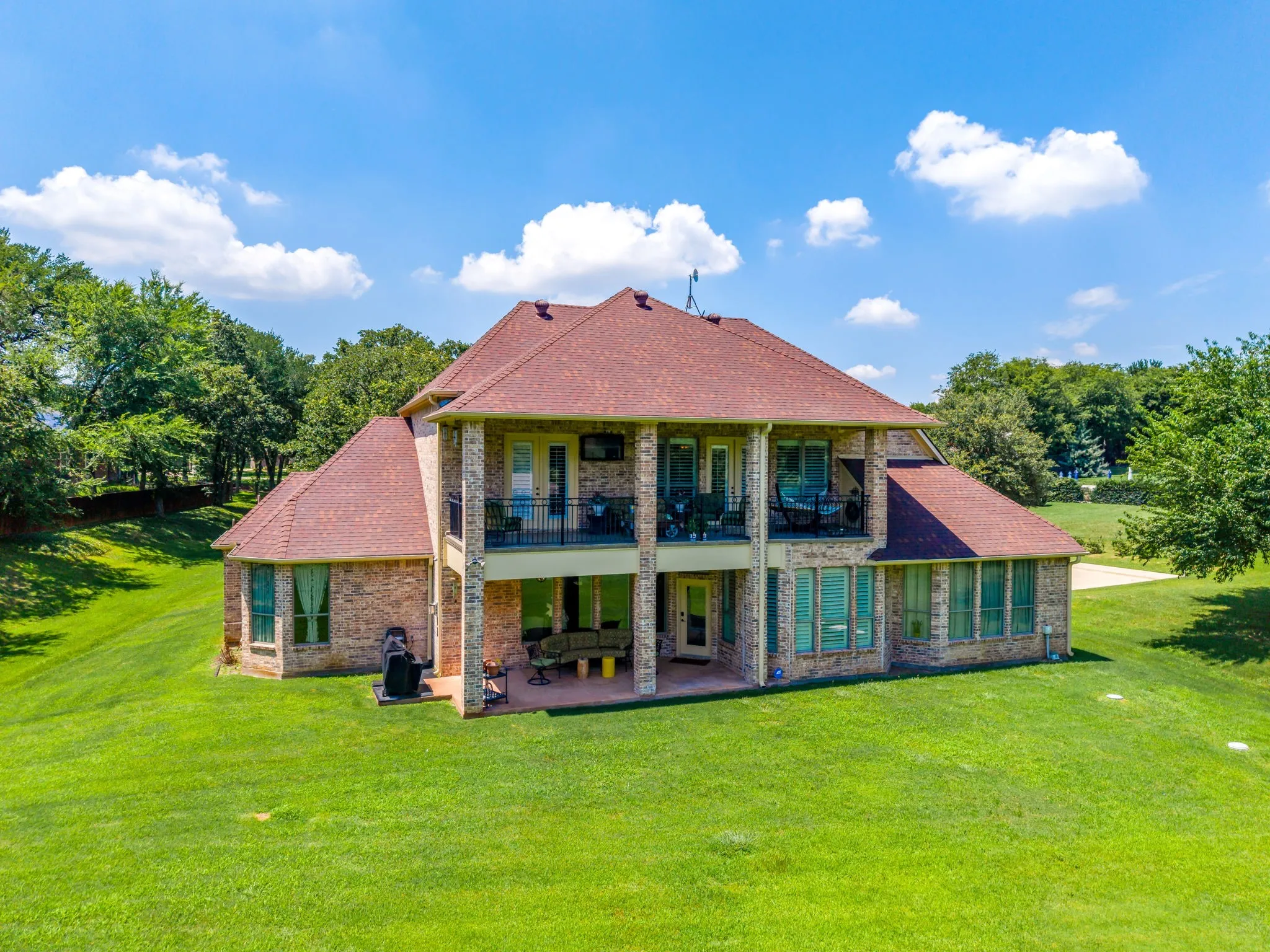 Back of house has 2 covered spaces to choose from!  The top balcony offers great views!