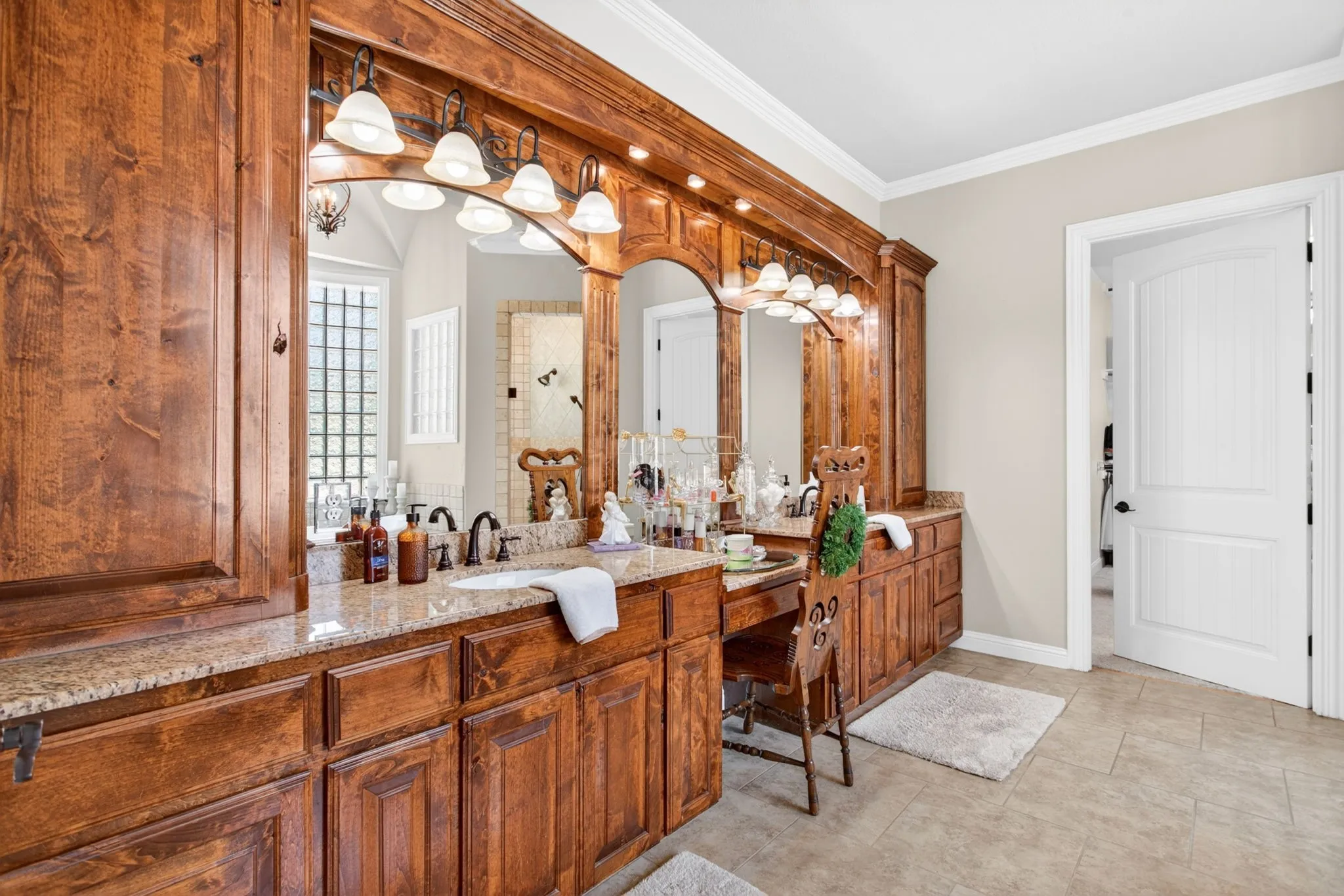 Primary bathroom has a huge vanity with double sinks and linen cupboards and a HUGE walk in closet!!