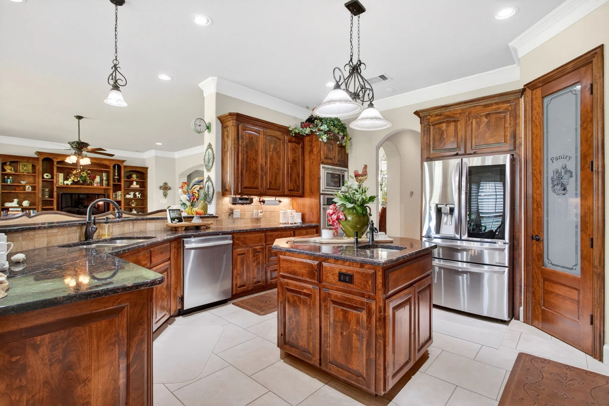 You'll find tons of counter space and storage in this kitchen!  Island has an additional prep sink.