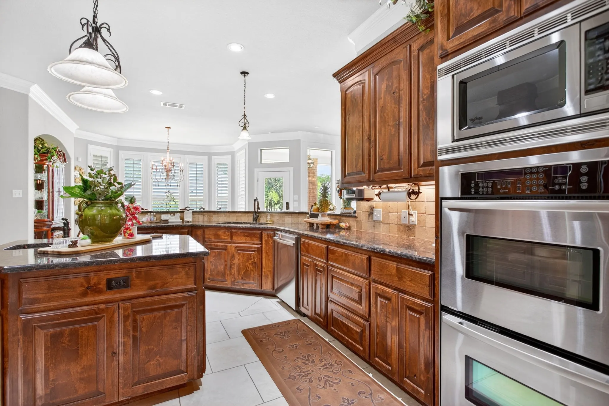 Double ovens and built in microwave help complete this chef's kitchen