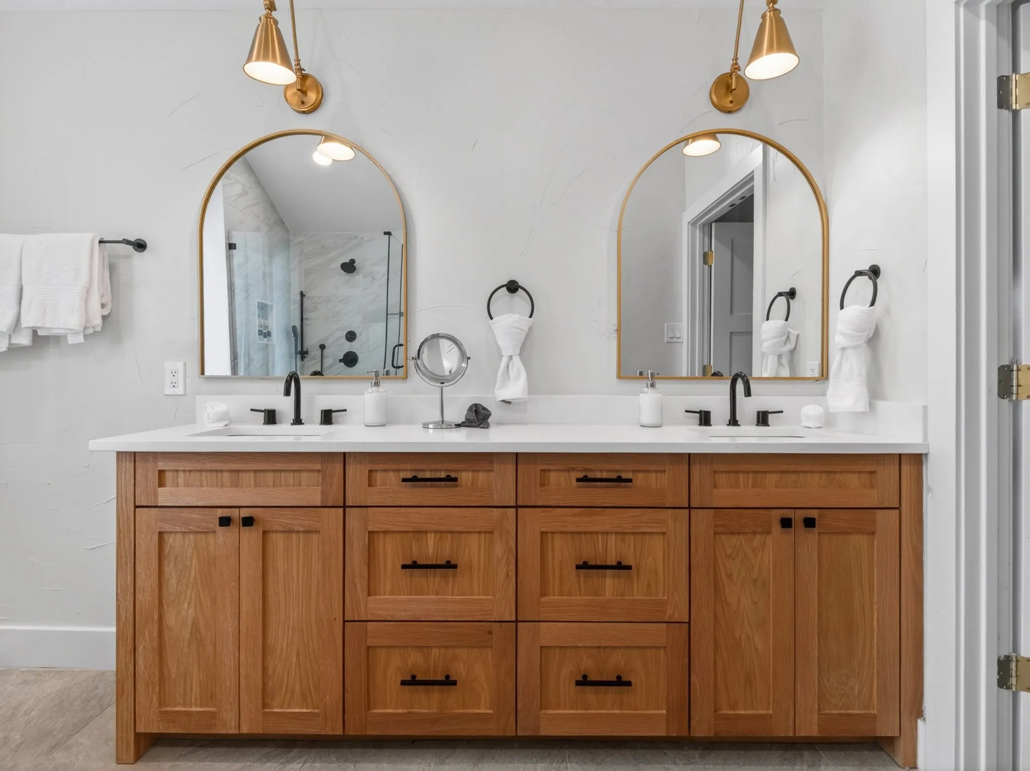 Renovated to spa luxury bathrooms with Double vanity with white countertop and integrated sinks, featuring wood-finish cabinetry